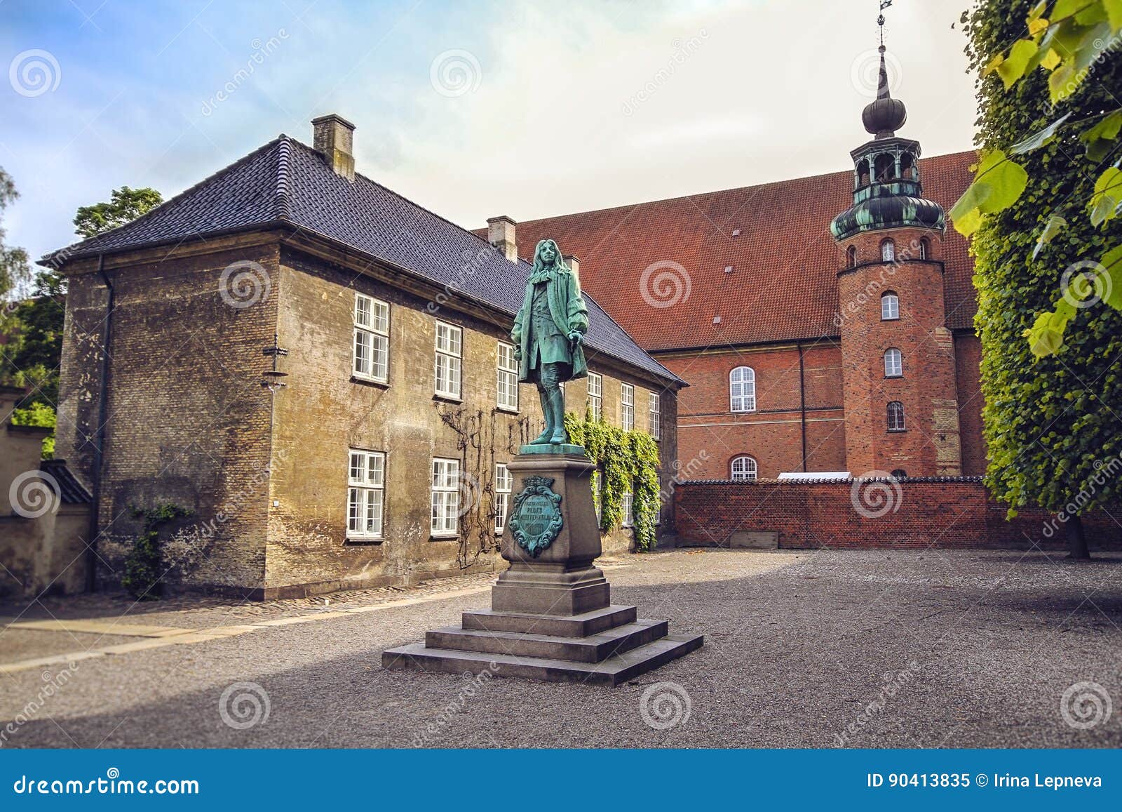 the statue of chancellor peder griffenfeld and a tower in copenhagen
