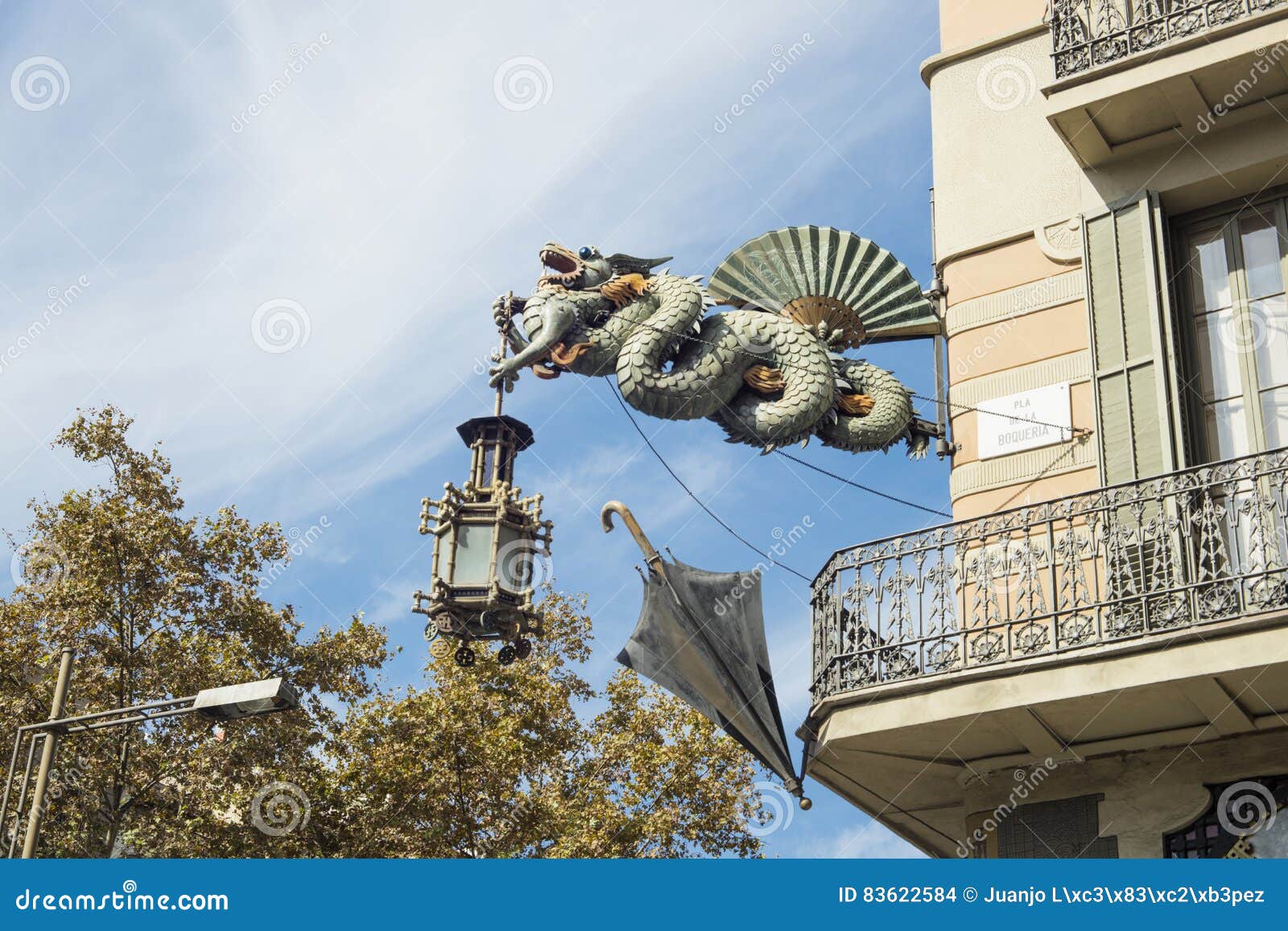 statue of dragon at `house of umbrellas` house bruno cuadros located in las ramblas in barcelona, catalonia, spain