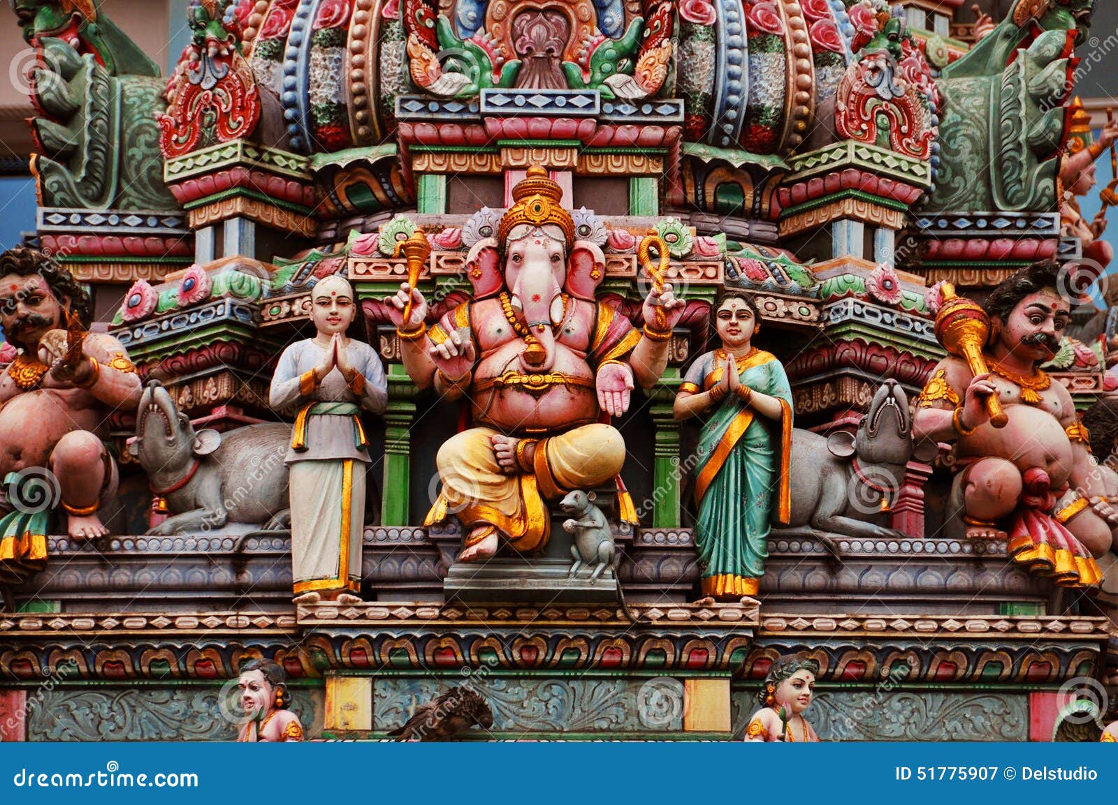 statue of ganesh on a colorful indian temple facade