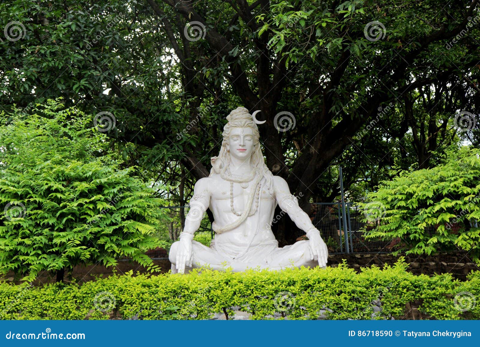 Statue of Hindu Lord Shiva Under the Tree, Rishikesh. India Stock Photo