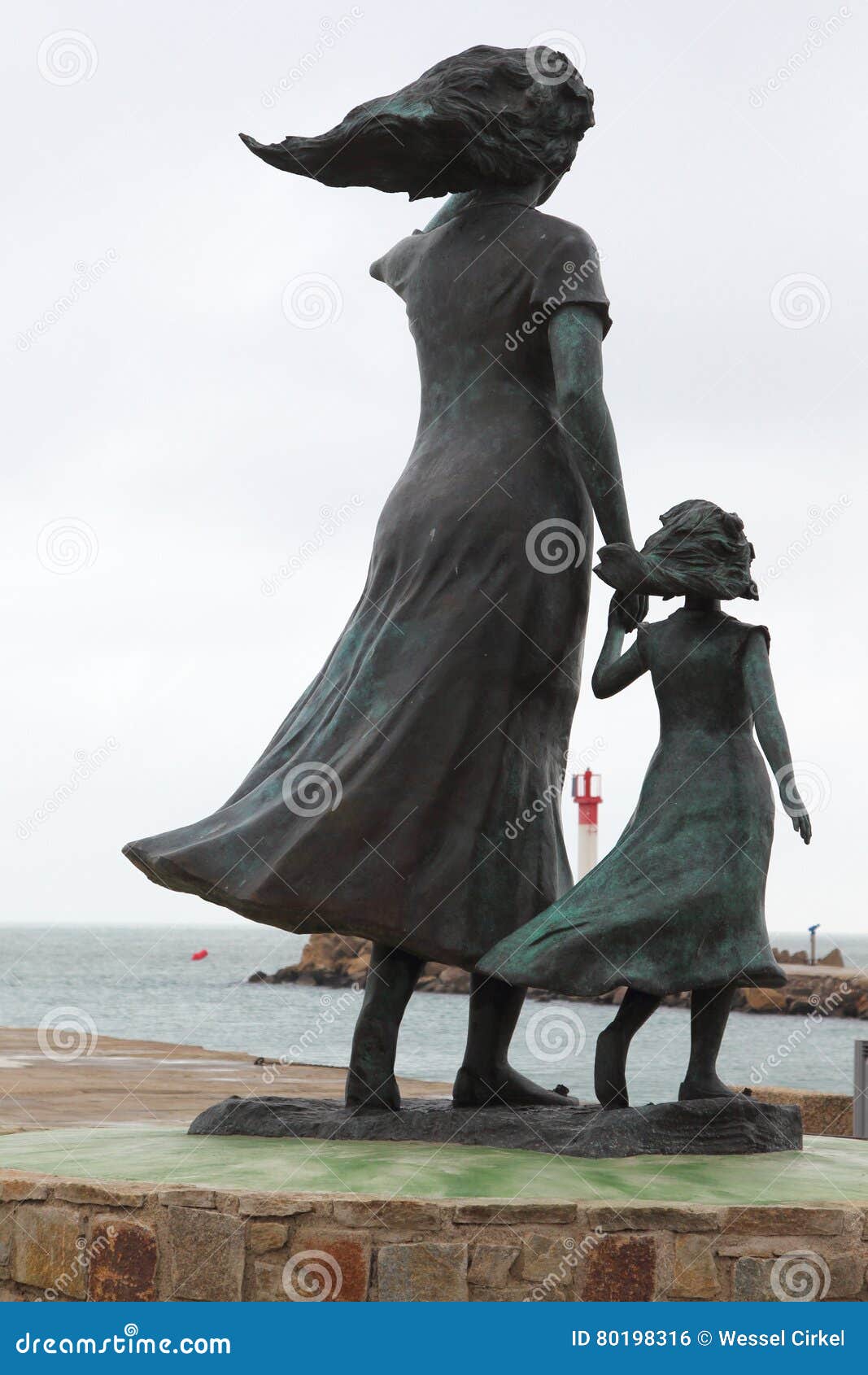 the statue of hope in le grau-du-roi fishing harbour, france