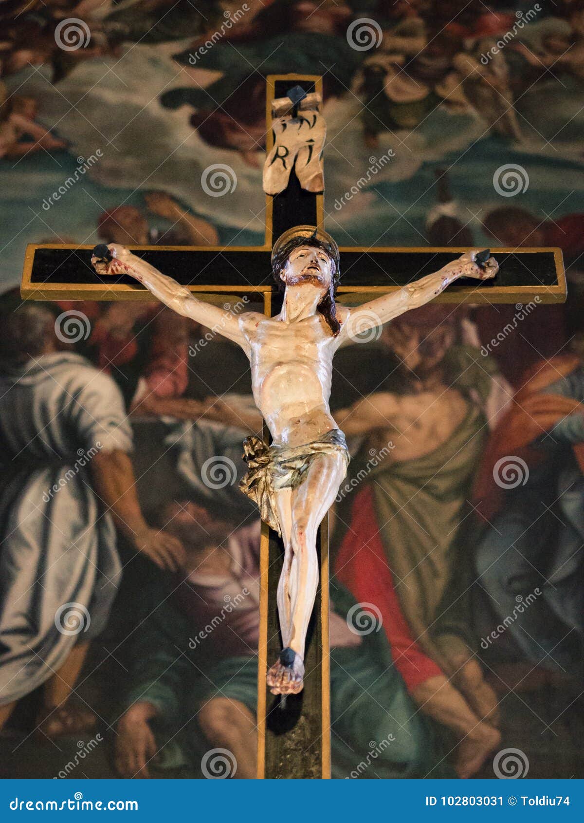 statue of jesus crucified in an ancient italian catholic church
