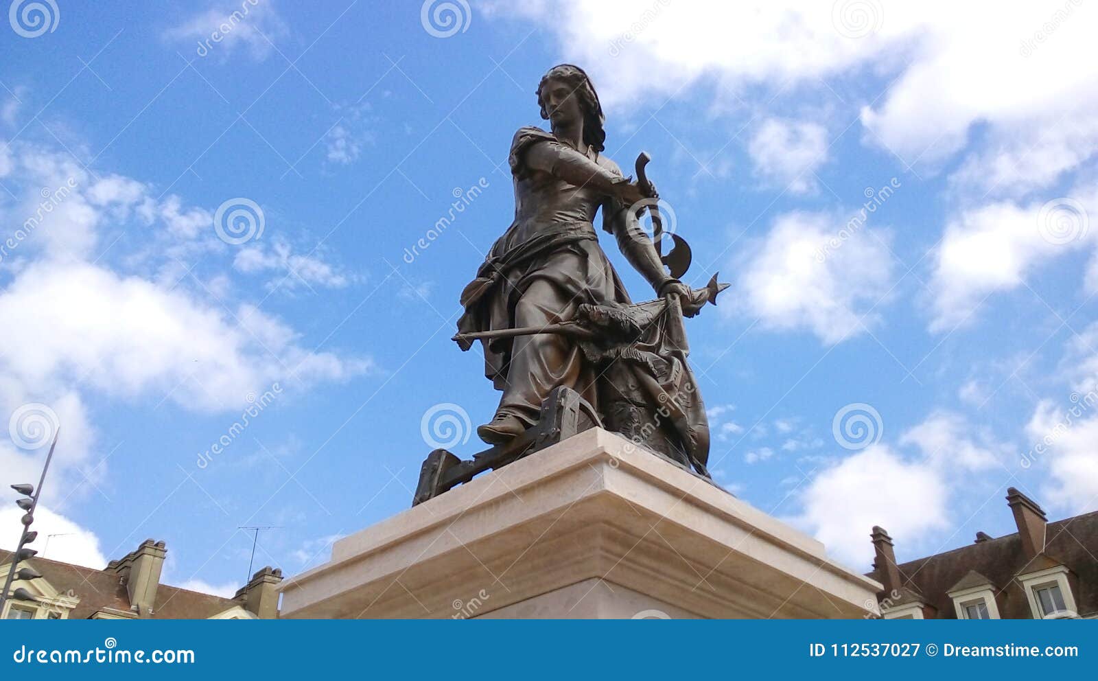 statue of joan of arc on a sunny day