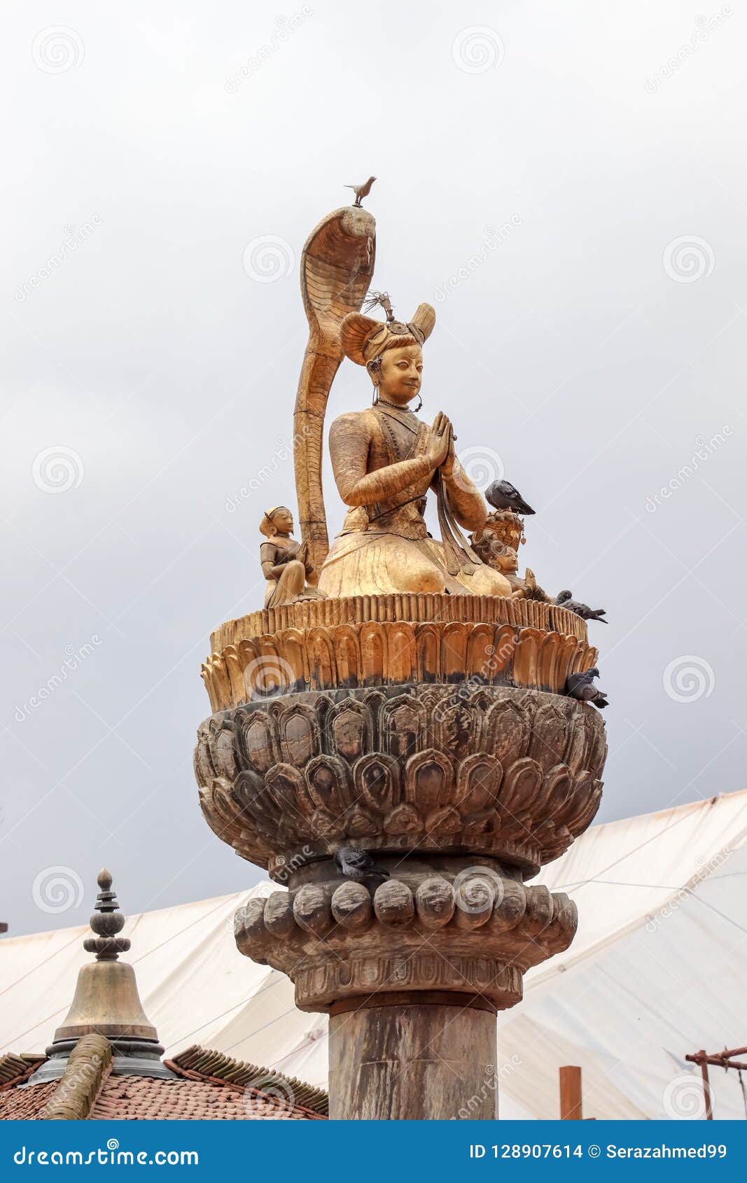 statue of king yog narendra malla at patan durbar square