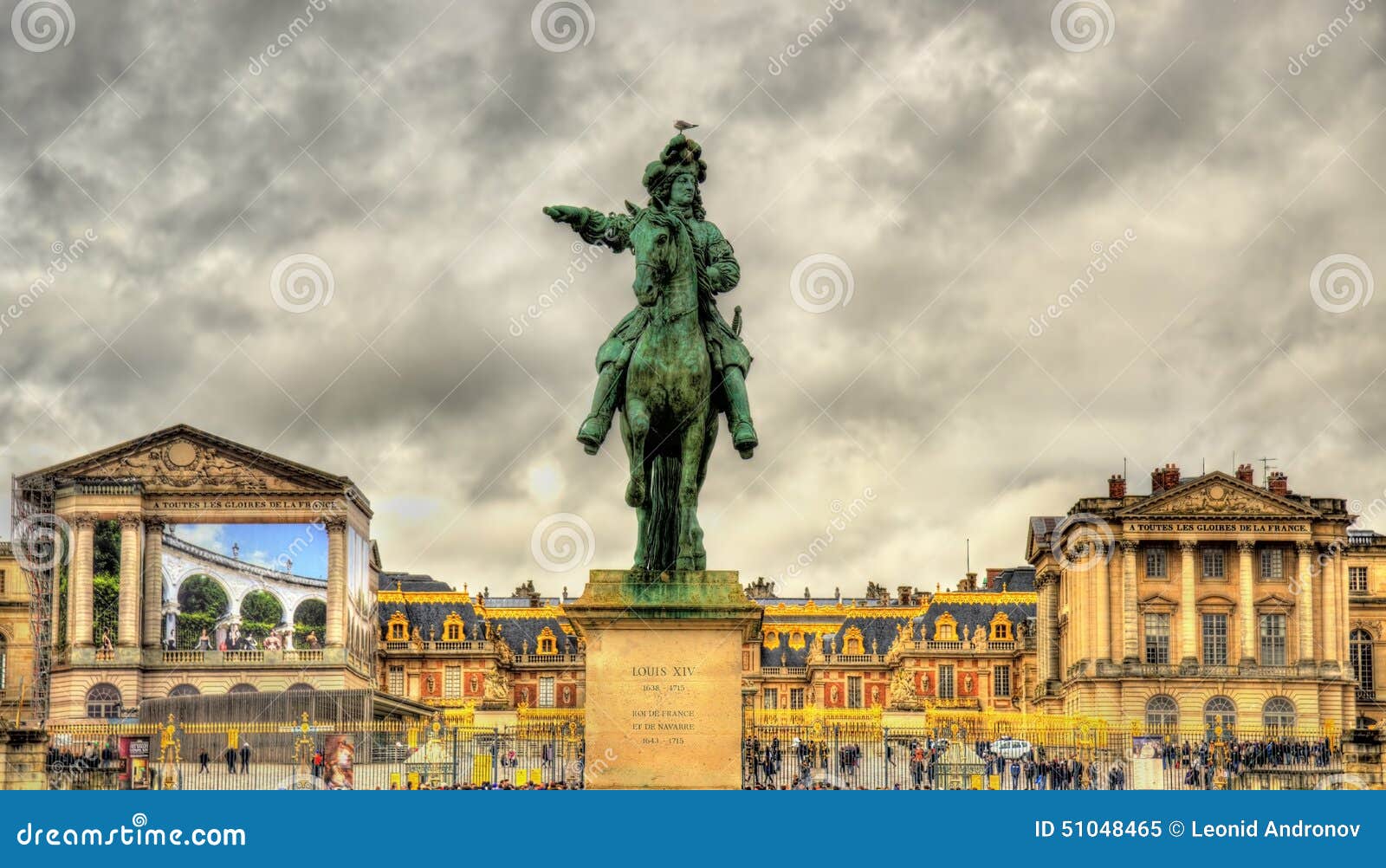 statue of louis xiv in front of the palace of versailles