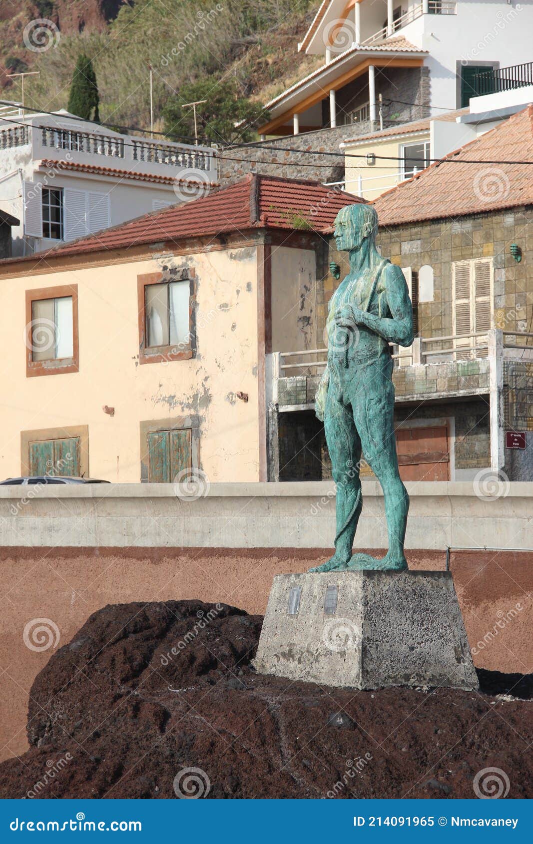 A Statue of a Man Looking Out To See in the Coastal Village of Paul Do