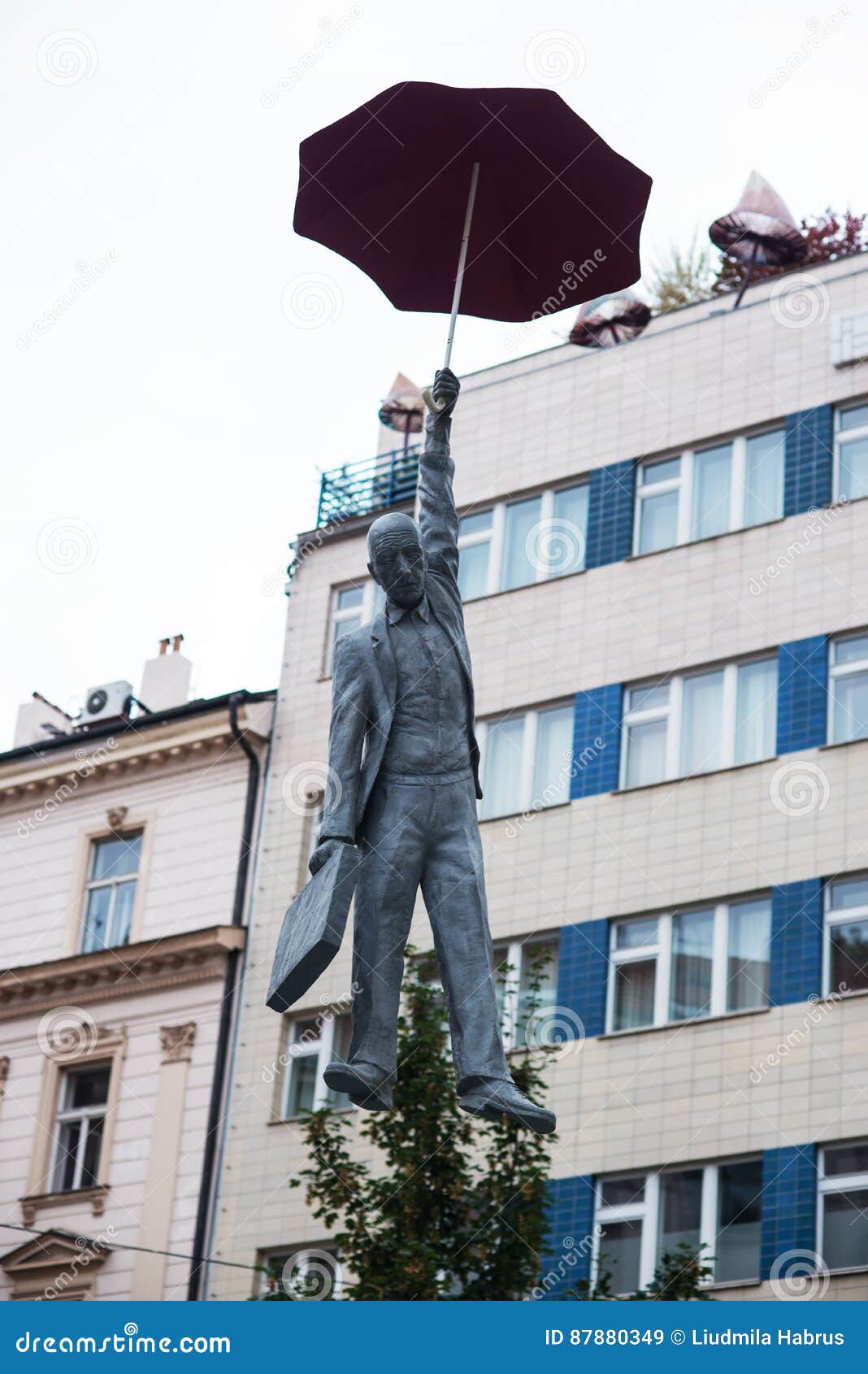 Statue of a Man with an Umbrella in Prague Editorial Stock Image