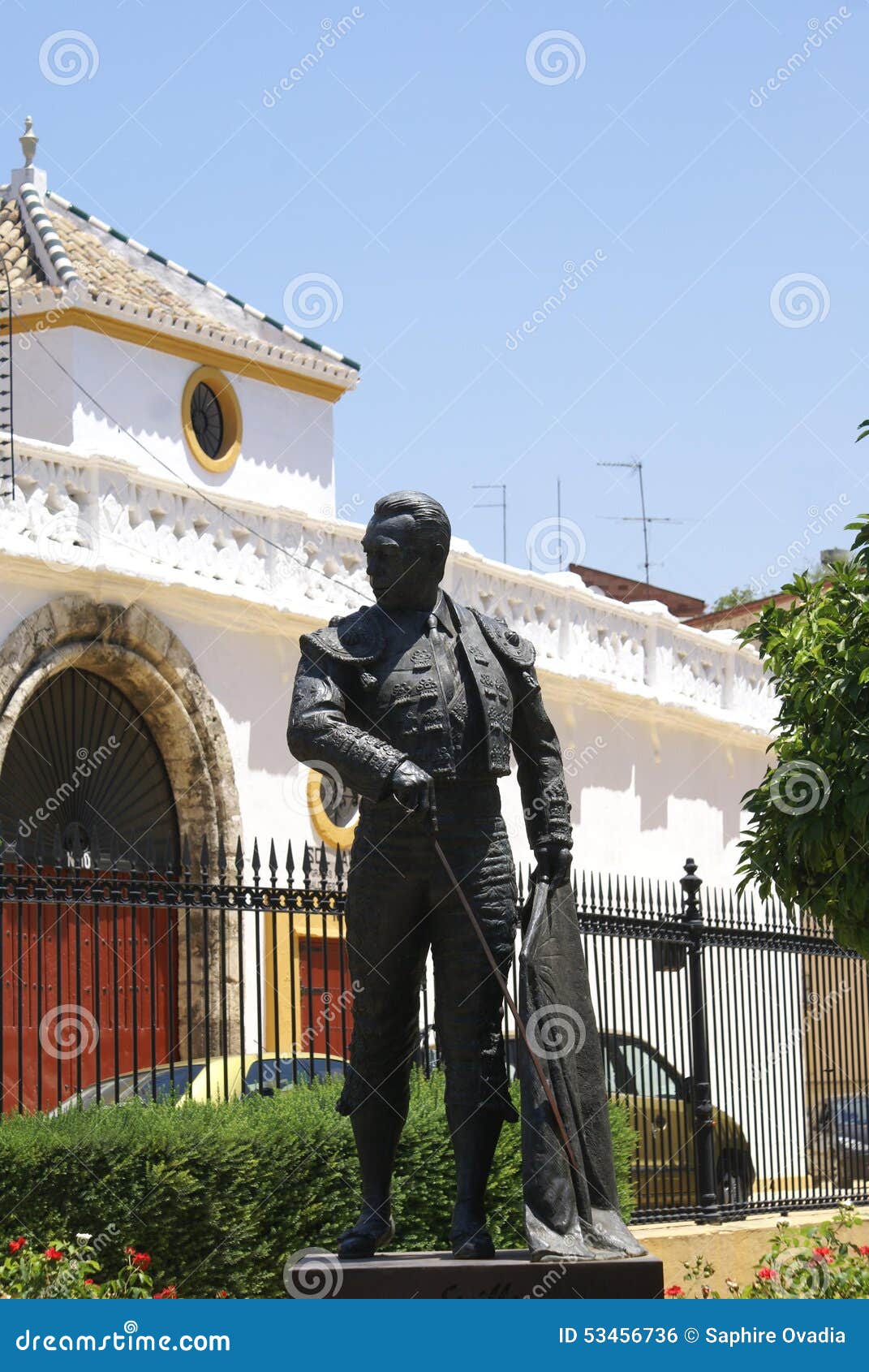 statue of matador curro romero outside the bullring in seville, spain