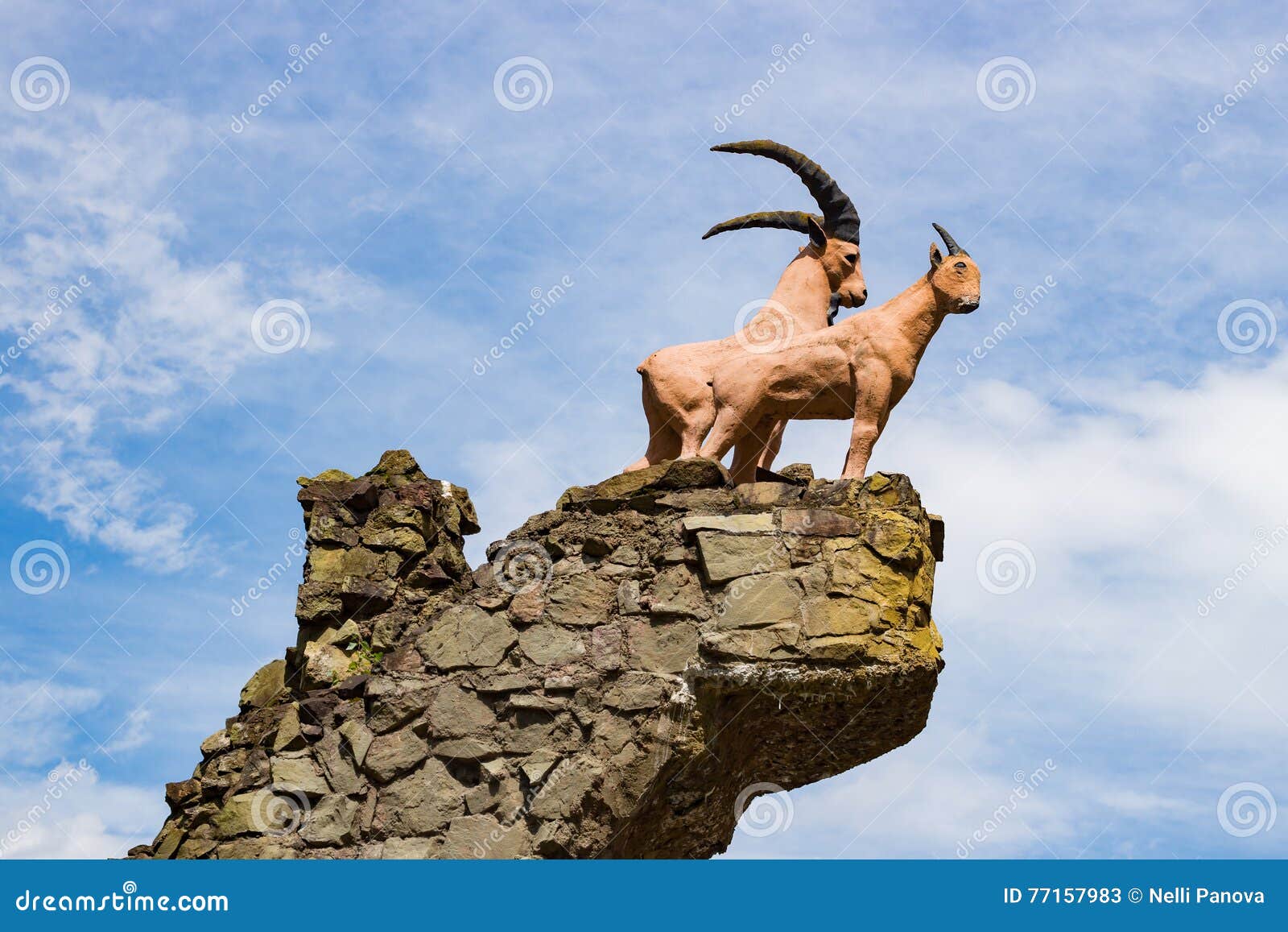 Козочка на небе 7 букв. Горные животные скульптура. Памятник горному козлу. В небо коза. Козёл статуя на горе.