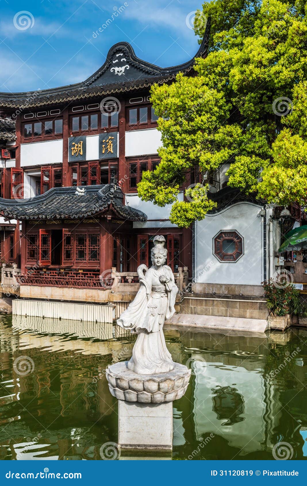 statue on a pond in fang bang zhong lu old city shanghai china