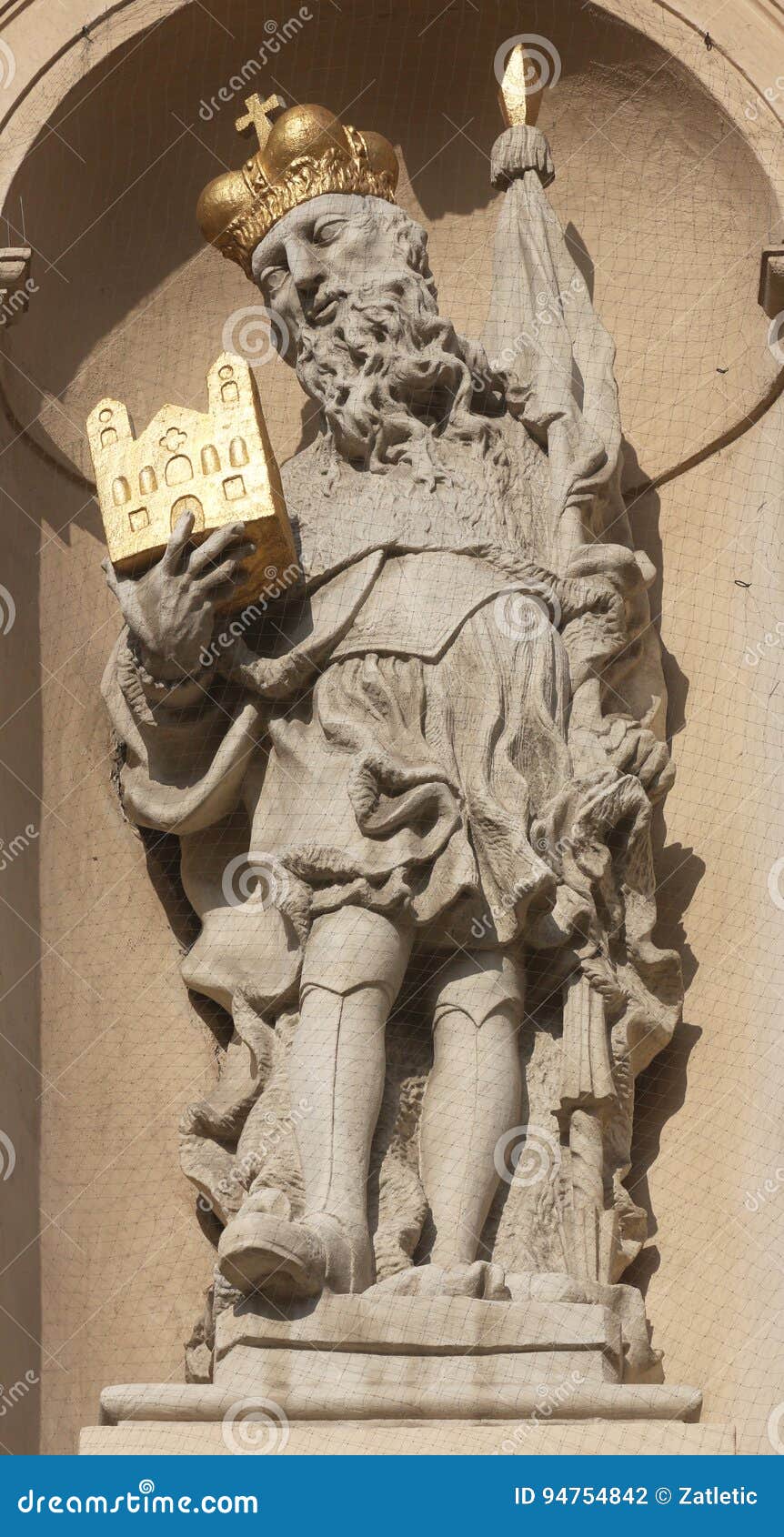 statue of saint on baroque jesuits church in vienna