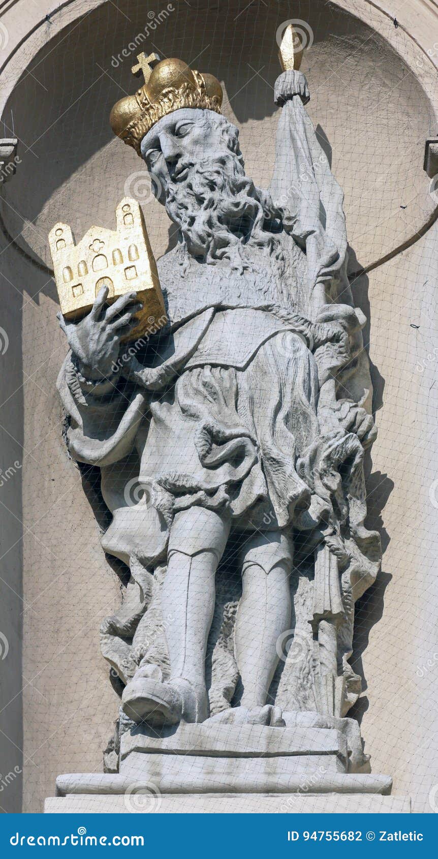statue of saint on baroque jesuits church in vienna