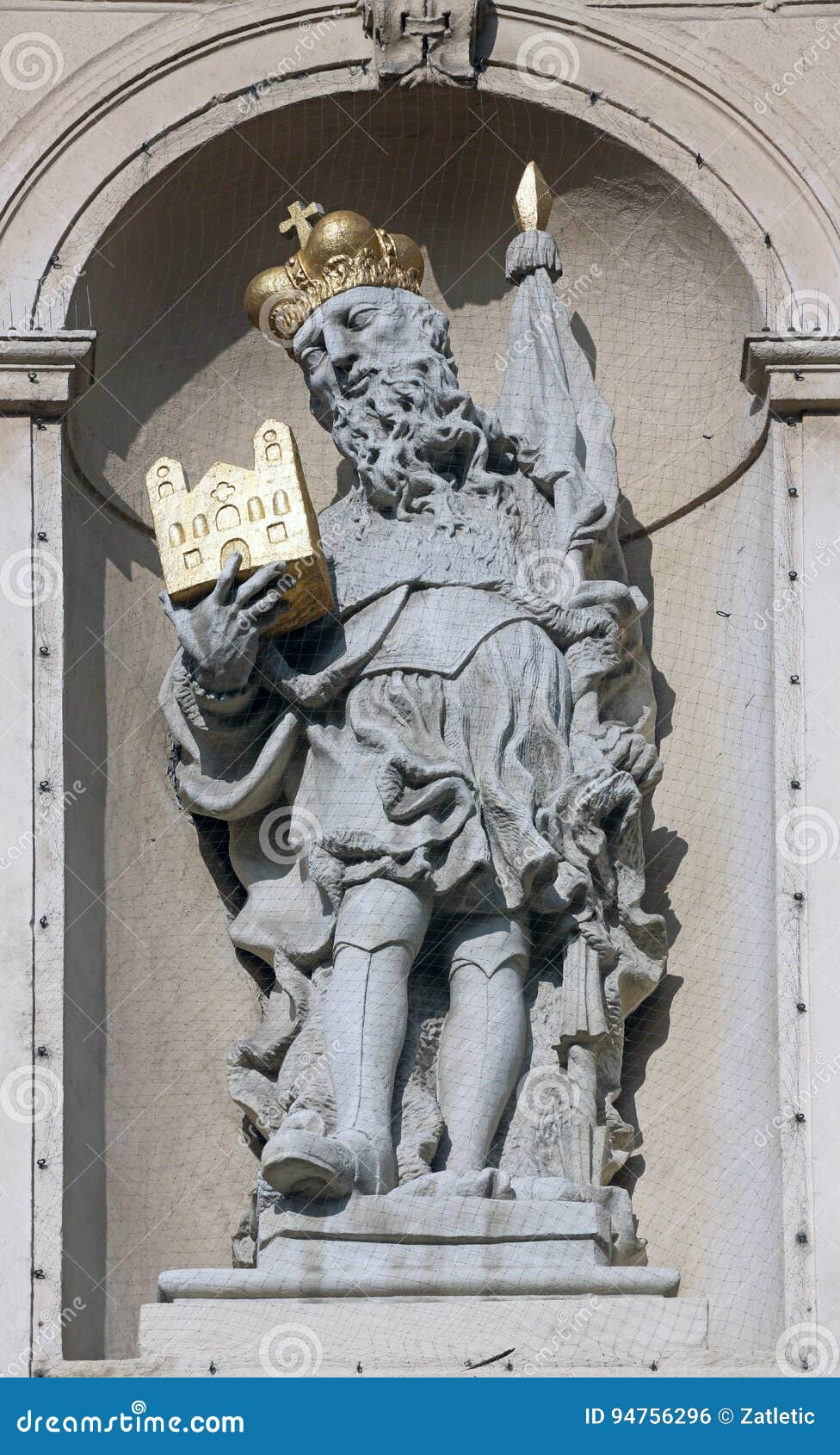 statue of saint on baroque jesuits church in vienna