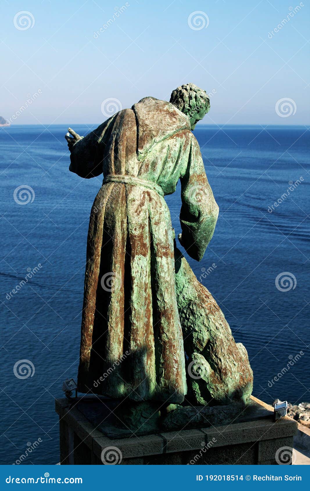 the statue of saint francis of assisi caressing the wolf of gubbio, monterosso al mare, cinque terre, italy.