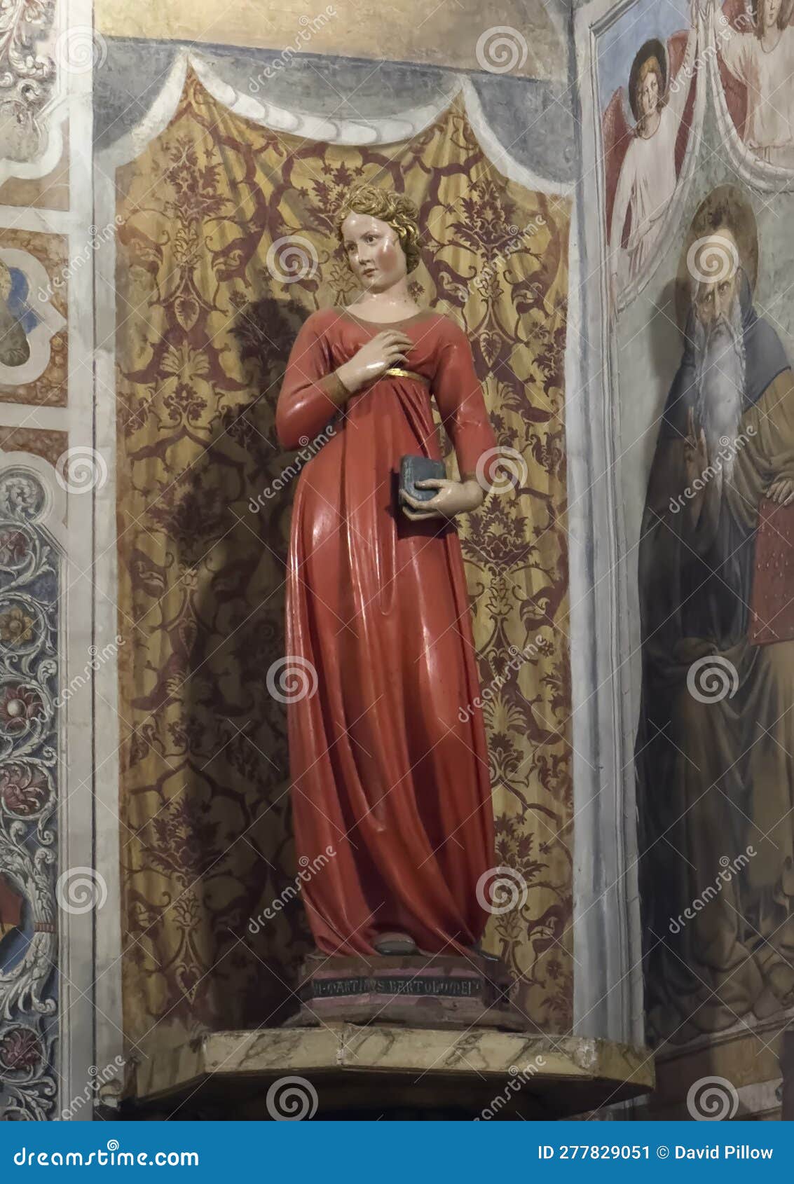 statue titled 'virgin annunciate' by jacopo della quercia in the colegiata di santa maria assunta in san gimignano.