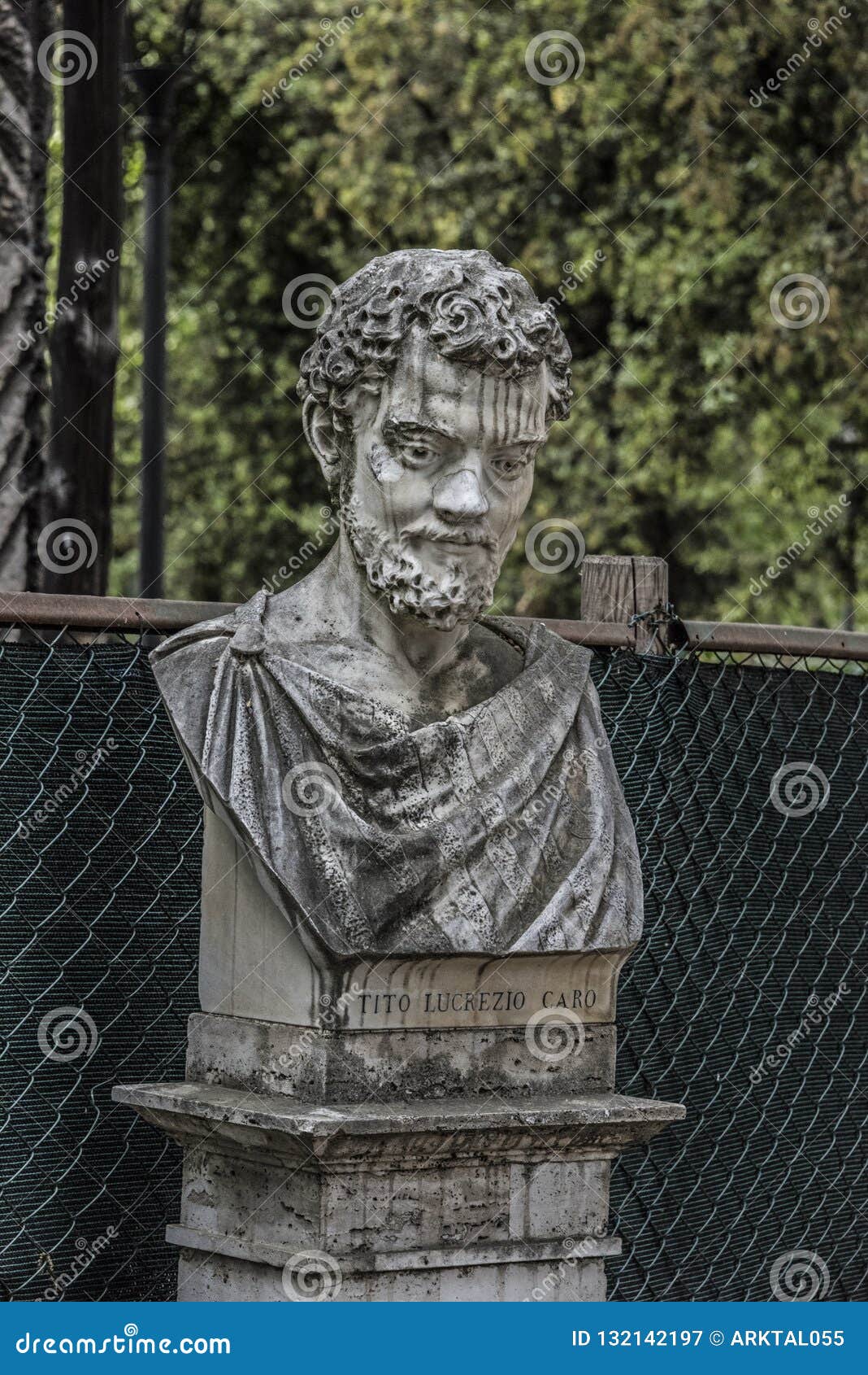 statue of tito lucrezio caro in the villa borghese gardens