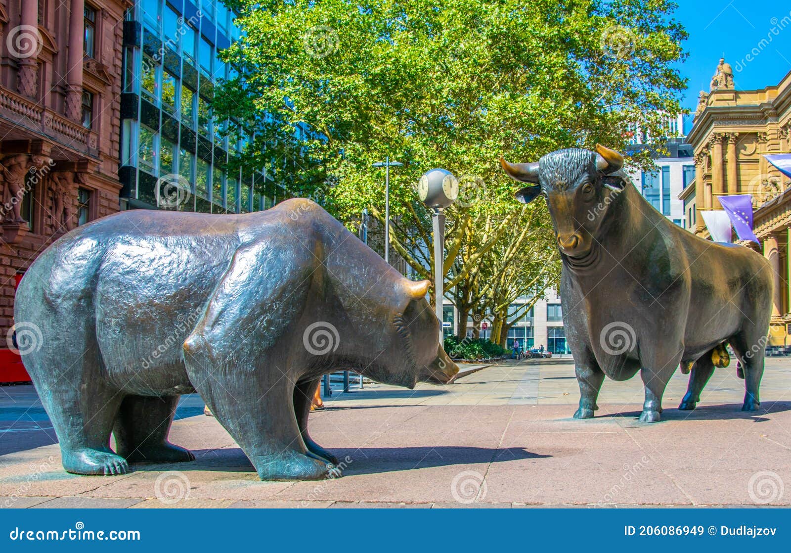 statues of a bear and a bull in front of stock exchange building in frankfurt, germany