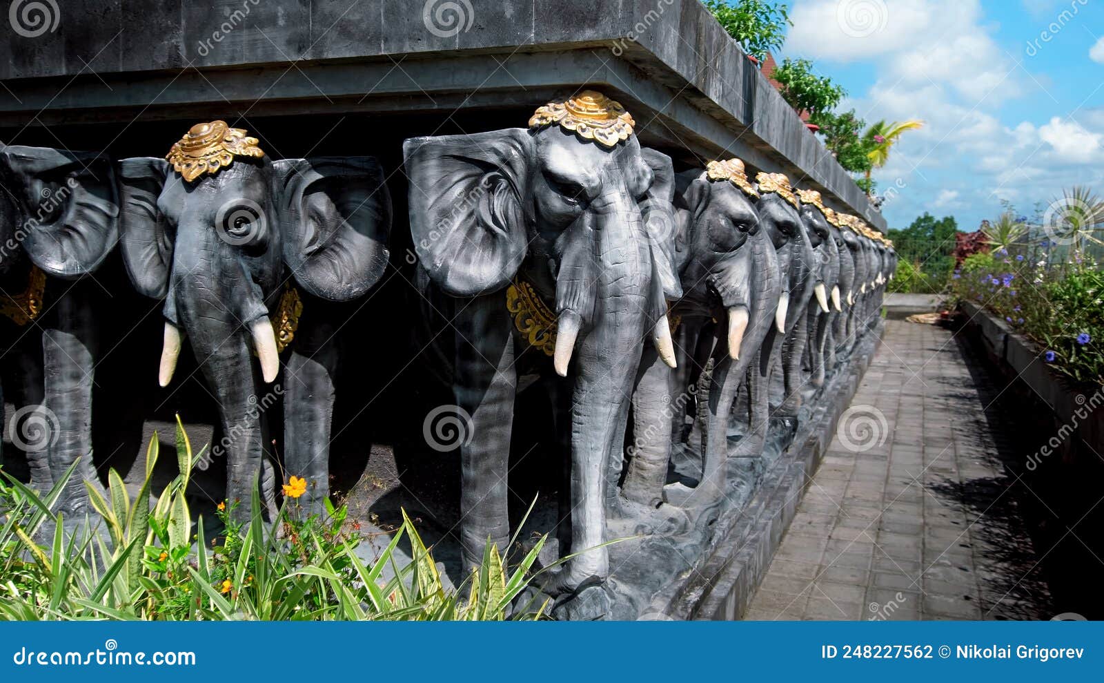 Statues of Elephants in Hats Holding a Concrete Slab Stock Photo ...