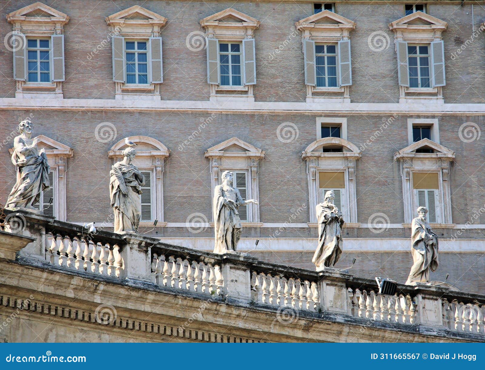 statues of founder saints atop the vatican