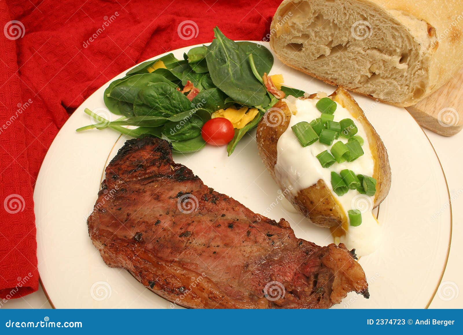 Steak and Baked Potato Dinner Stock Image - Image of cream, dish: 2374723