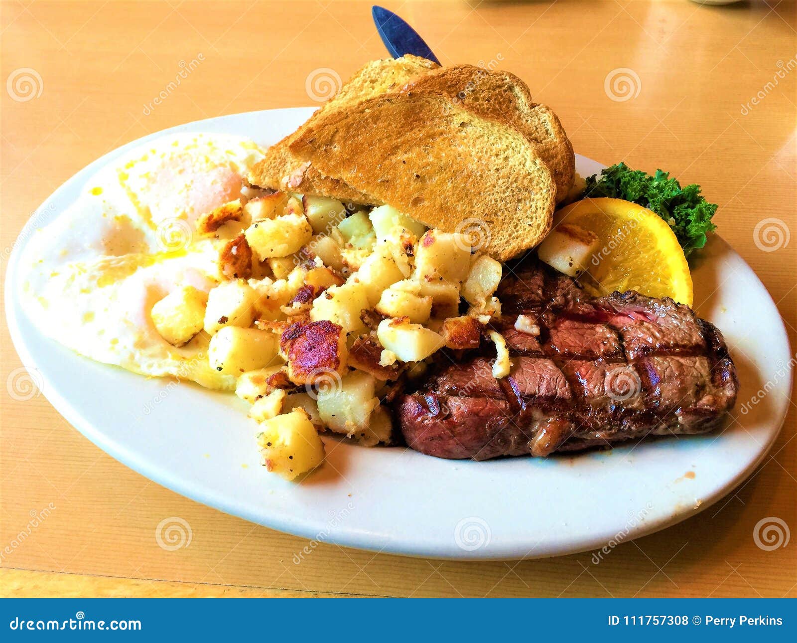 Steak and Eggs Breakfast stock photo. Image of wheat - 111757308