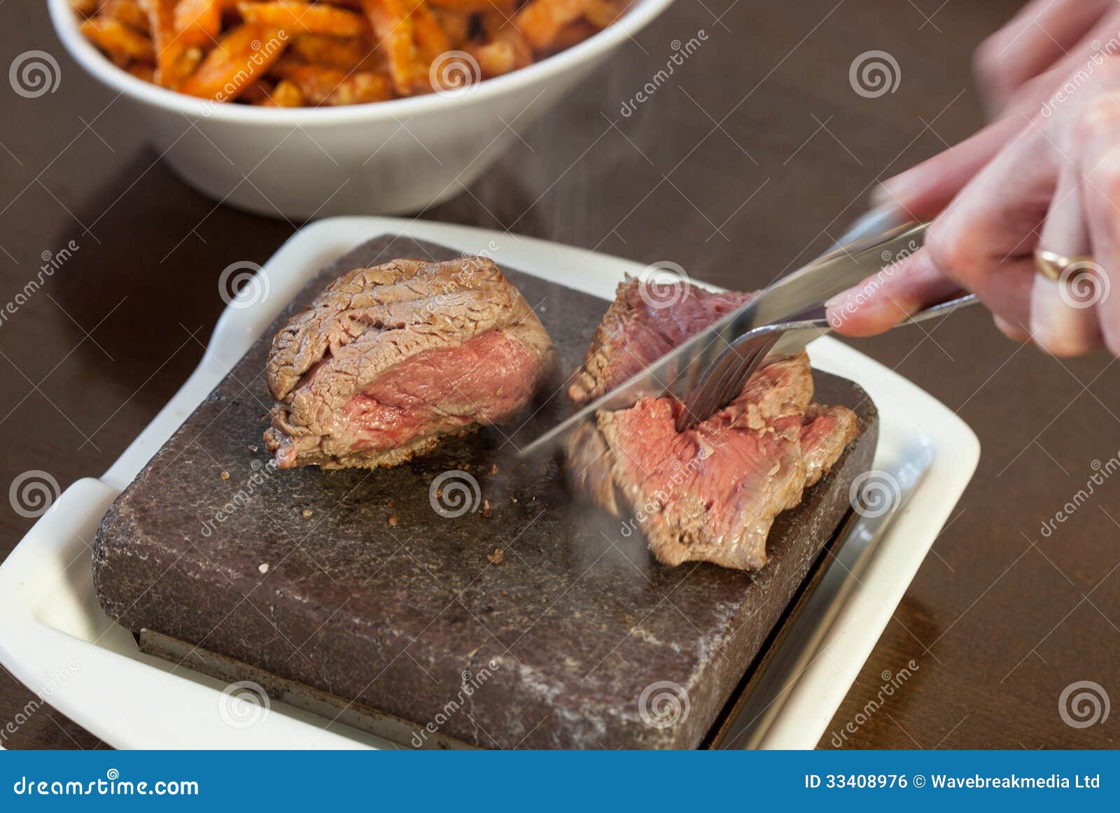 Steak Sizzling on Hot Stone Plate Being Sliced Stock Photo Image of