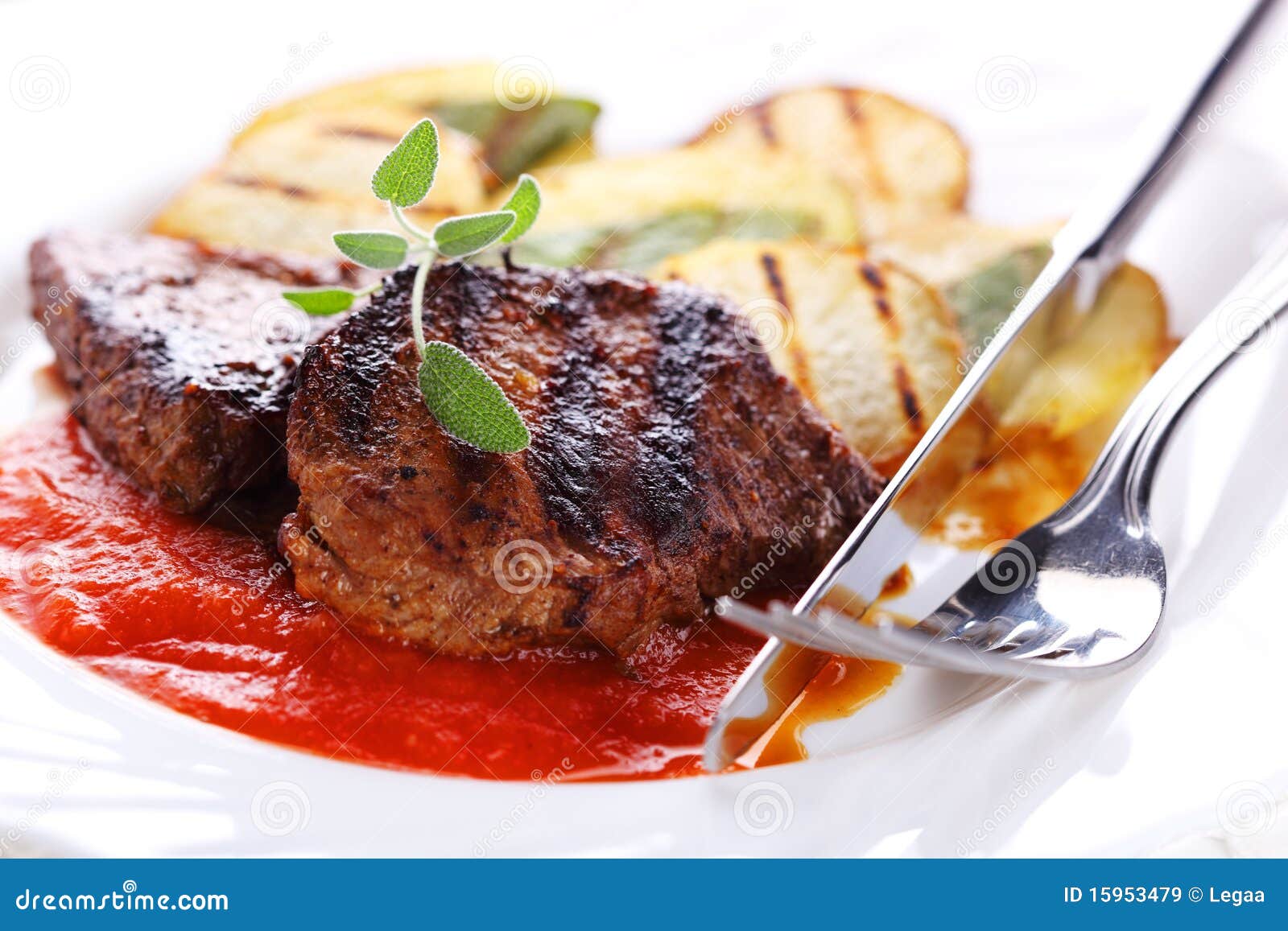 Steak with tomato sauce stock image. Image of elegance 15953479