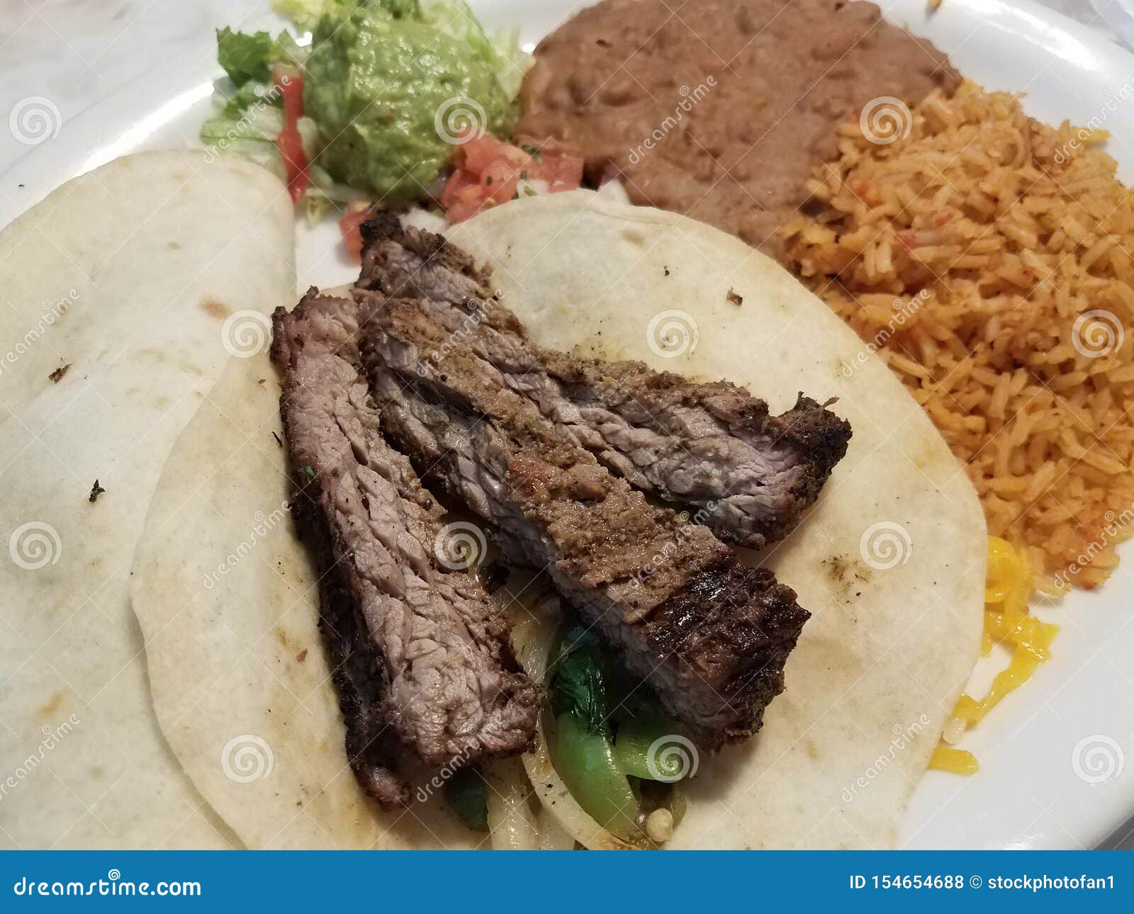Steak and Tortilla and Beans and Rice on Plate Stock Photo Image of