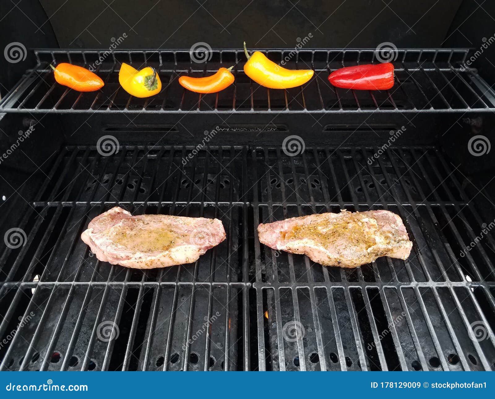 Steaks on Barbecue Grill with Colorful Peppers Stock Image Image of
