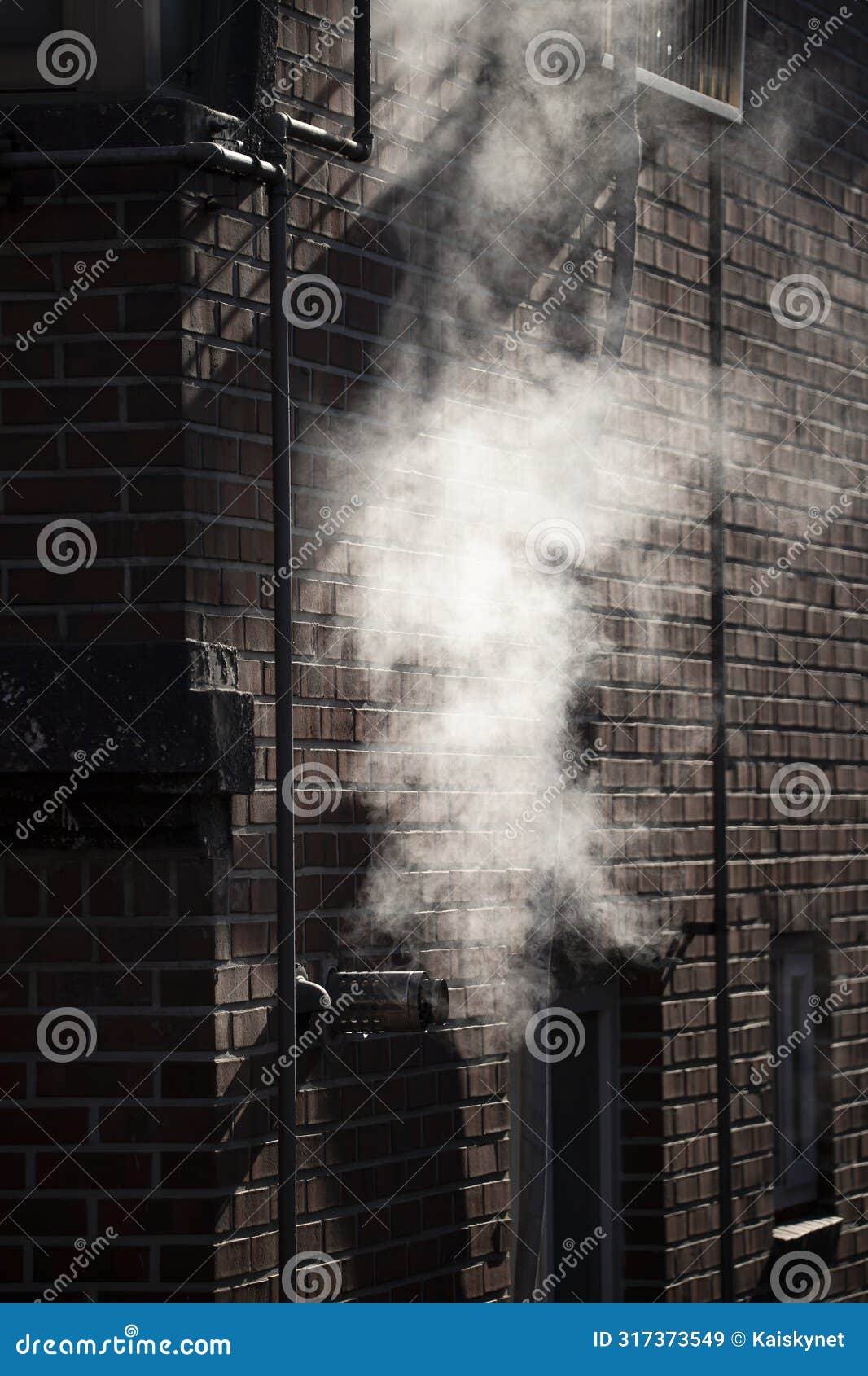 steam coming out of a central heating flue on a house wall in south korea