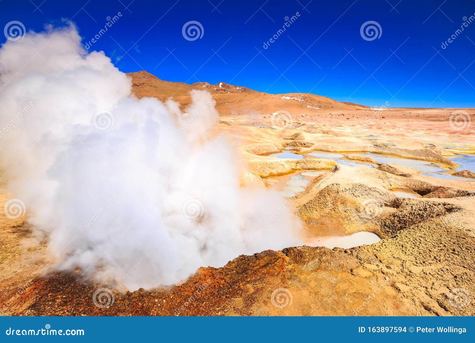 steam coming out of the `sol de la manana`  geyser in bolivia