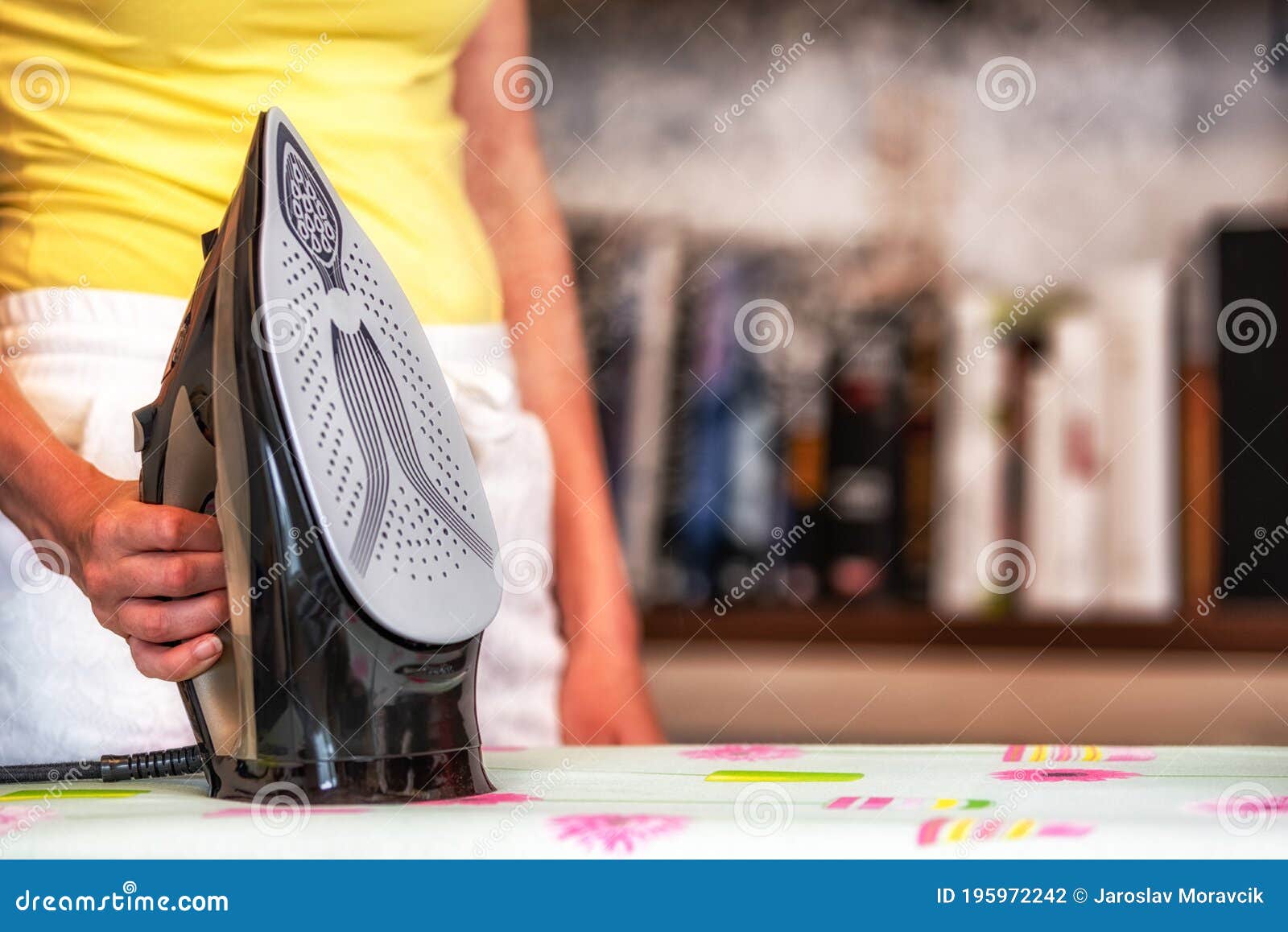Steam from iron in hand stock photo. Image of woman 195972242