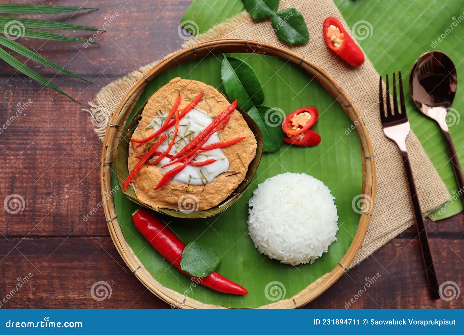 Steamed Fish Curry in Banana Leaf Cups Served with White Rice and Spicy Fish  Sauce - Famous Thai Food Called Hor Mok or Fish Amok Stock Image - Image of  green, curry: 231894711