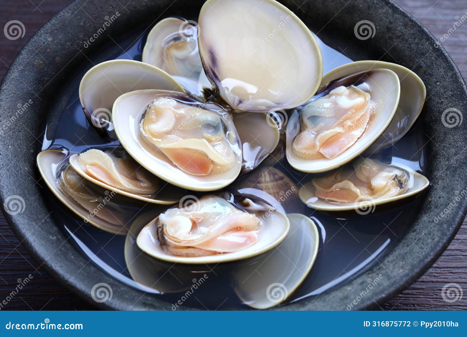 steamed hamaguri clams with japanese rice wine (sake).