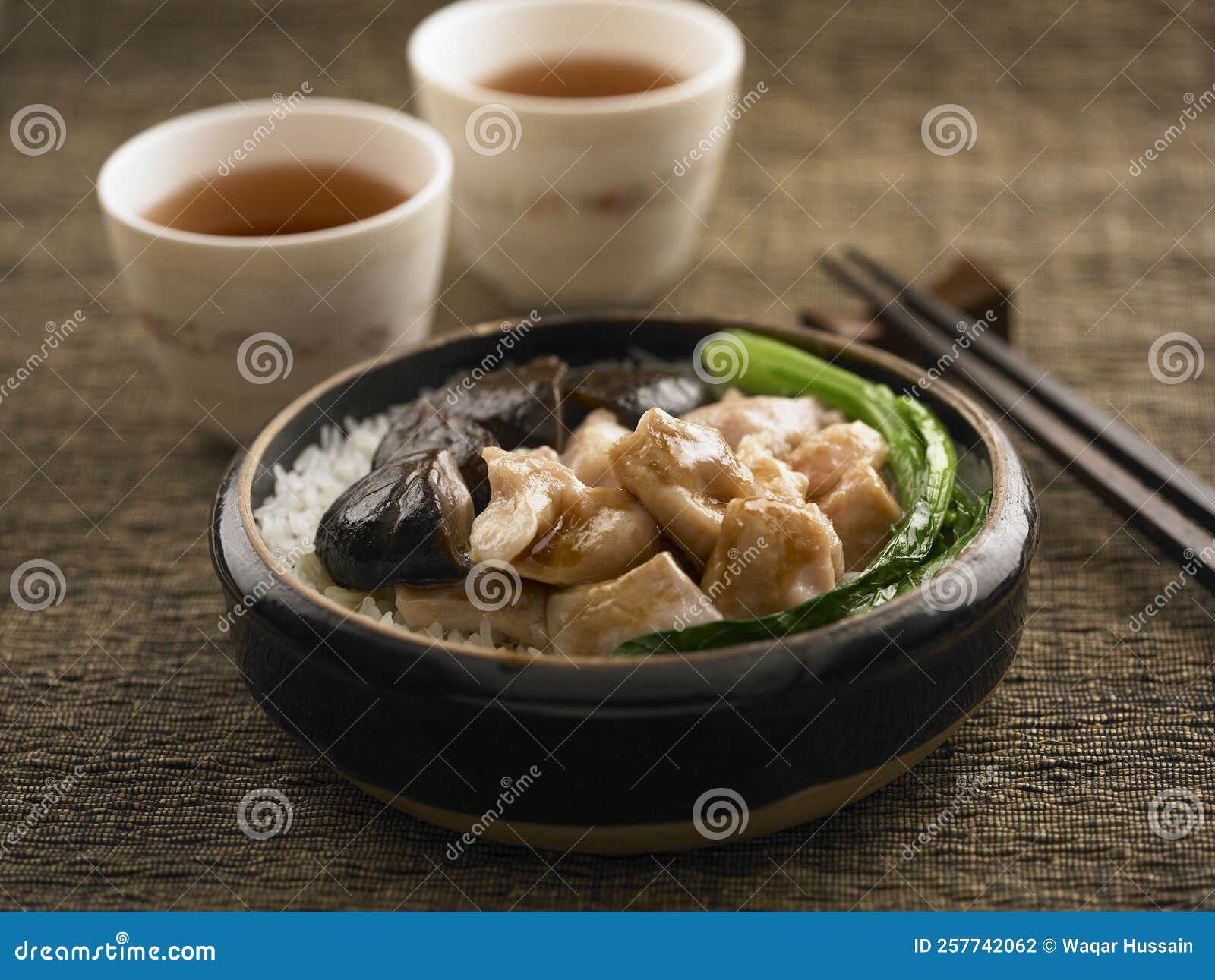 Steamed Rice with Chicken and Mushroom Served in a Dish Isolated on