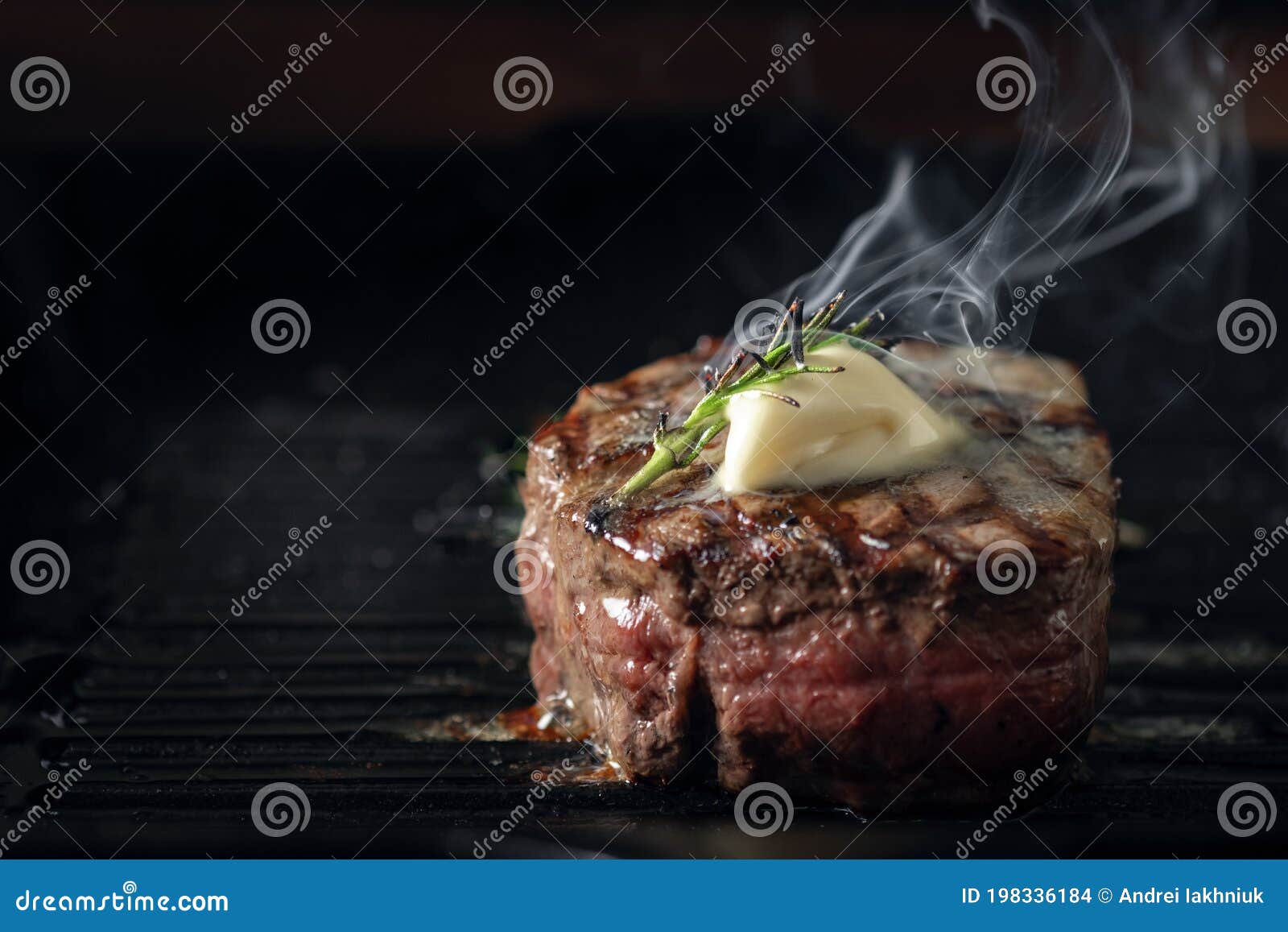 a steaming beef tenderloin steak is grilled