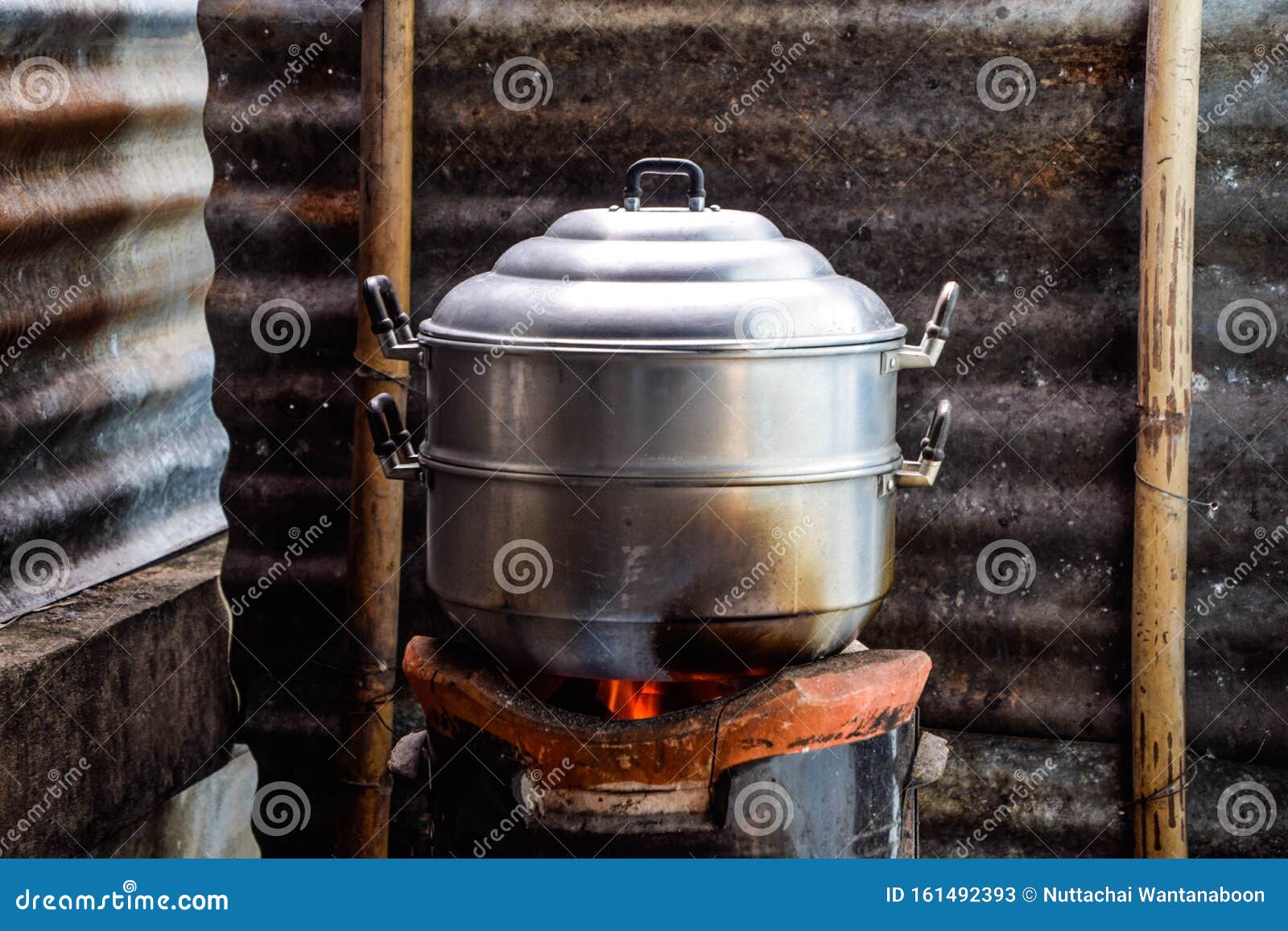 Boiling Water In Traditional Old Pot On Charcoal Stove Brazier Stock Photo,  Picture and Royalty Free Image. Image 38642693.