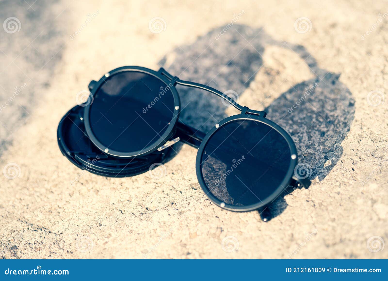Fashion cat eye sunglasses model for ladies with big blue lenses and black  frame shoot outside in a sunny day closeup. Selective focus Stock Photo -  Alamy
