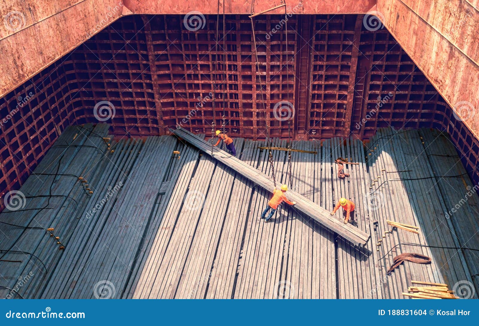 steel billets stacked to loading from a ship in port - the raw material for the manufacture of parts.