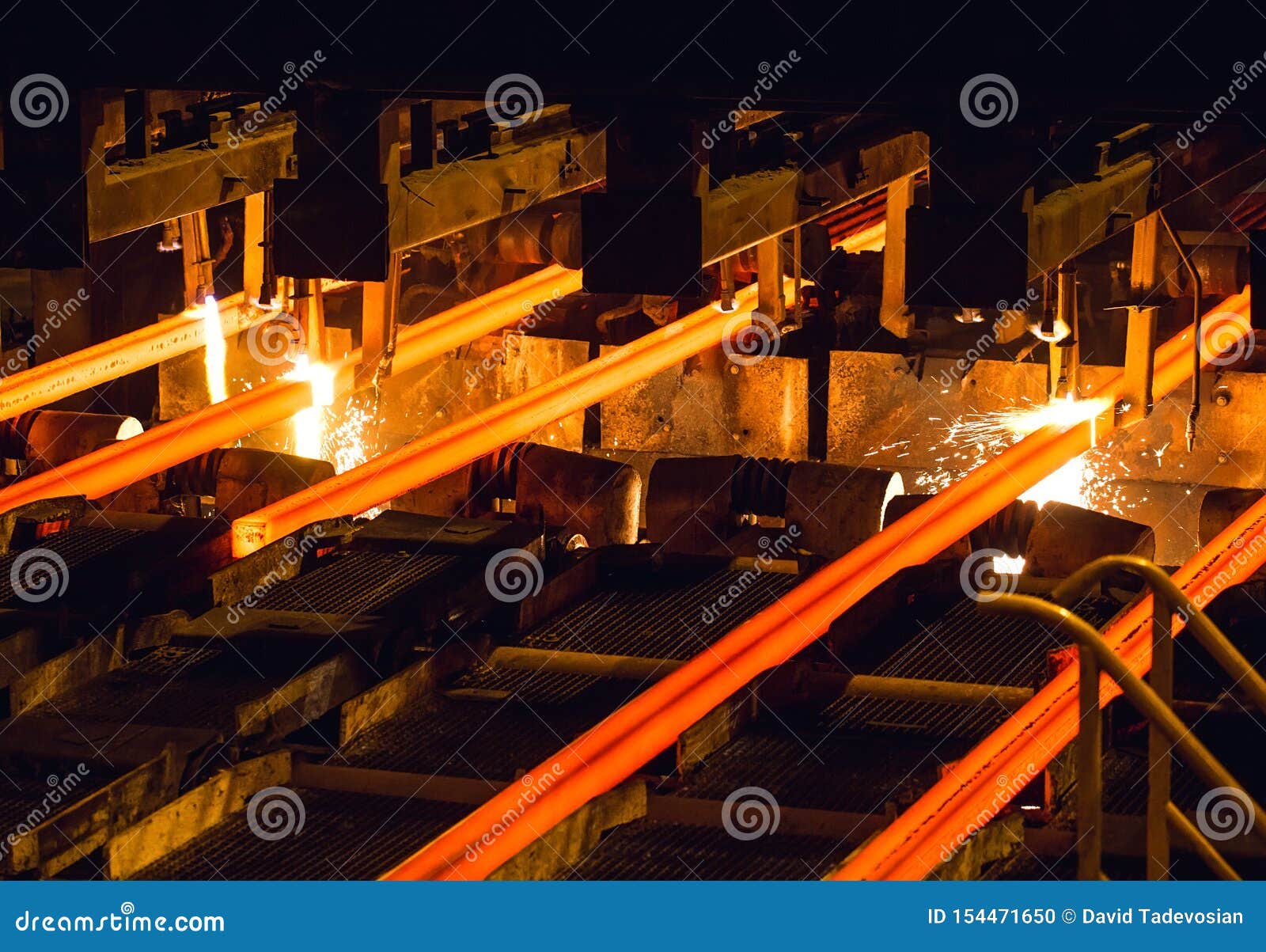 steel billets at torch cutting. huge ironworks.