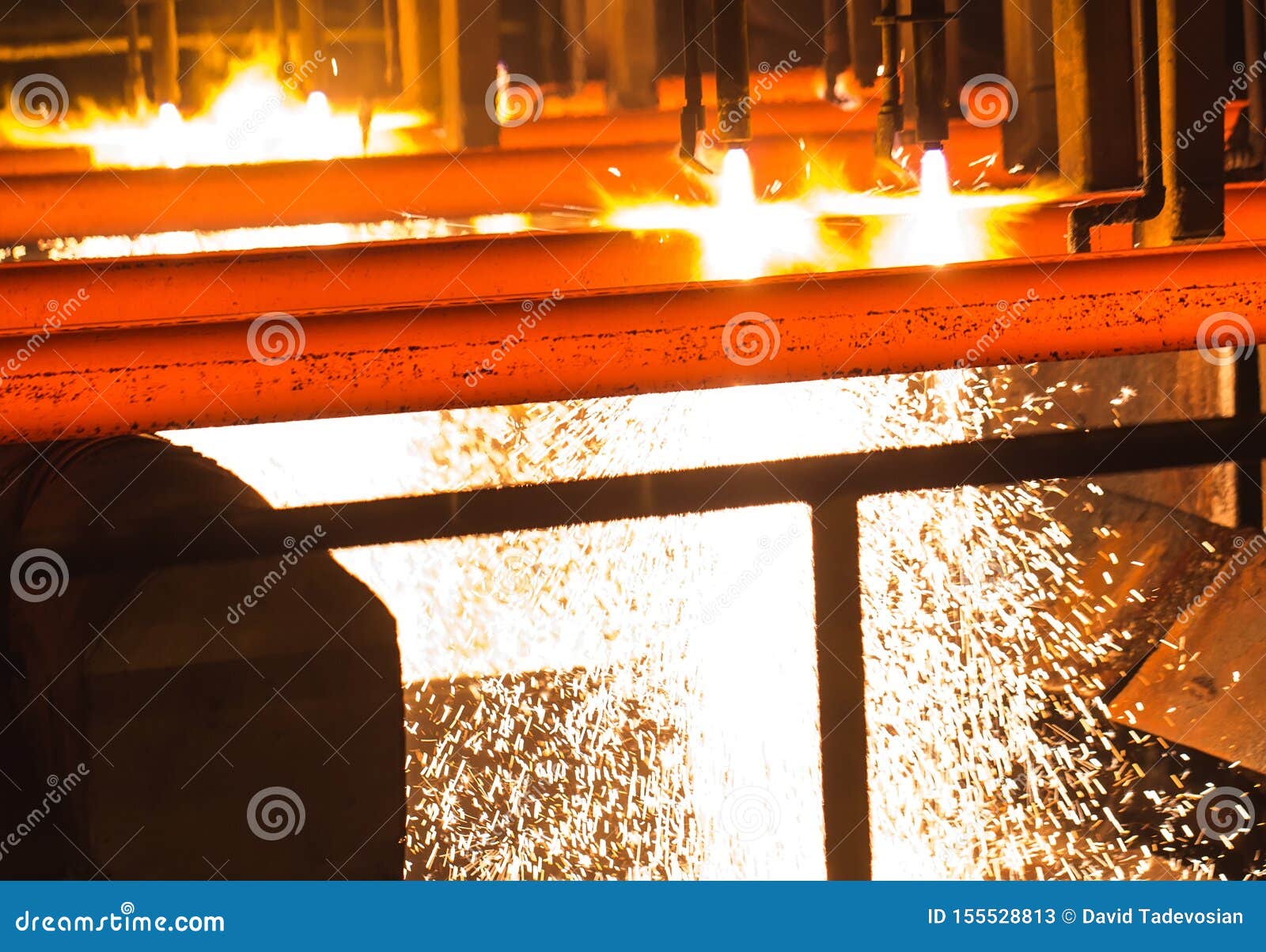 steel billets at torch cutting. hot billet bloom continuous casting, also called strand casting