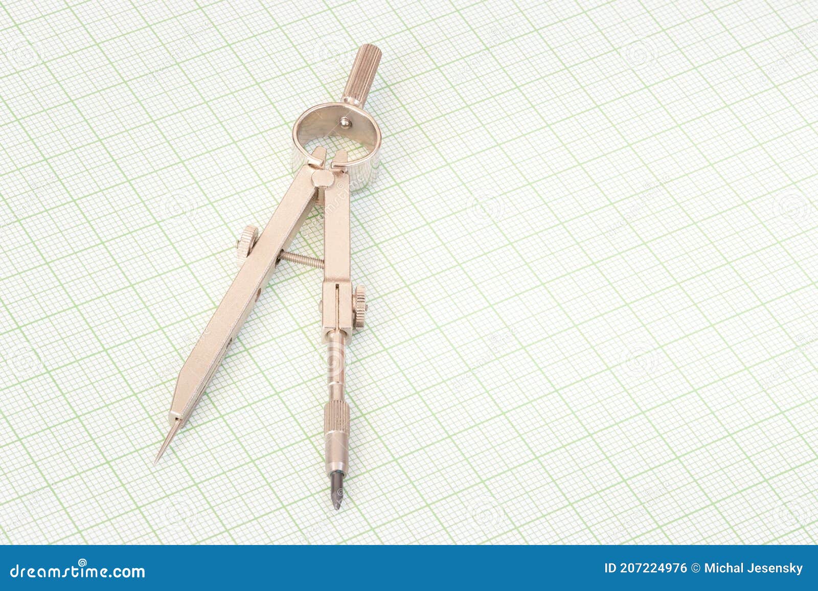 steel compasses on a millimetre paper