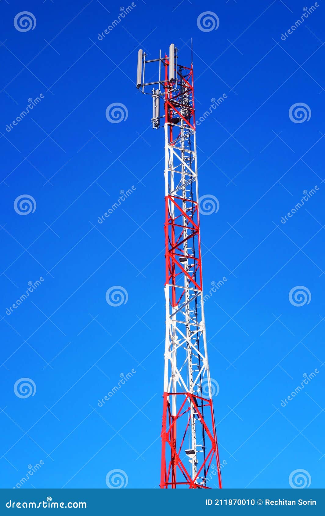 image of a telecommunication tower against the blue sky