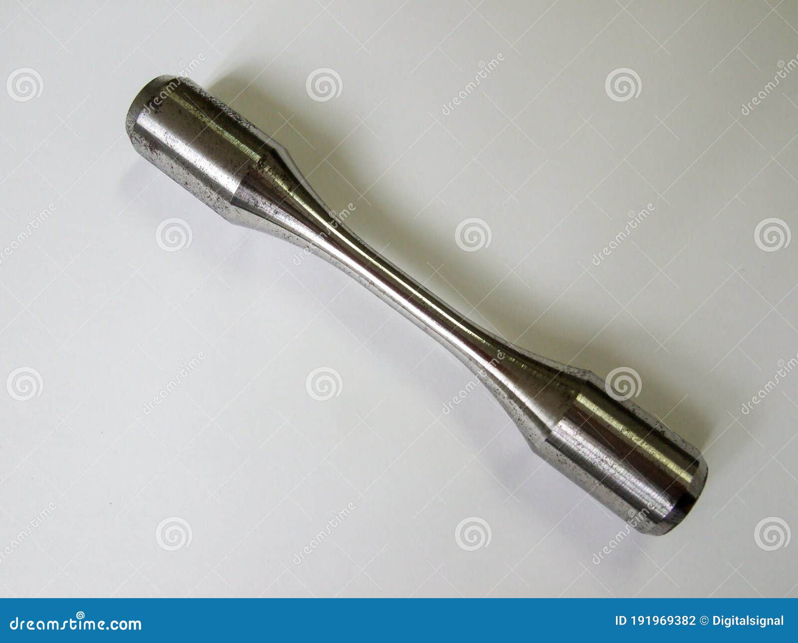 steel specimen for traction tests  on background