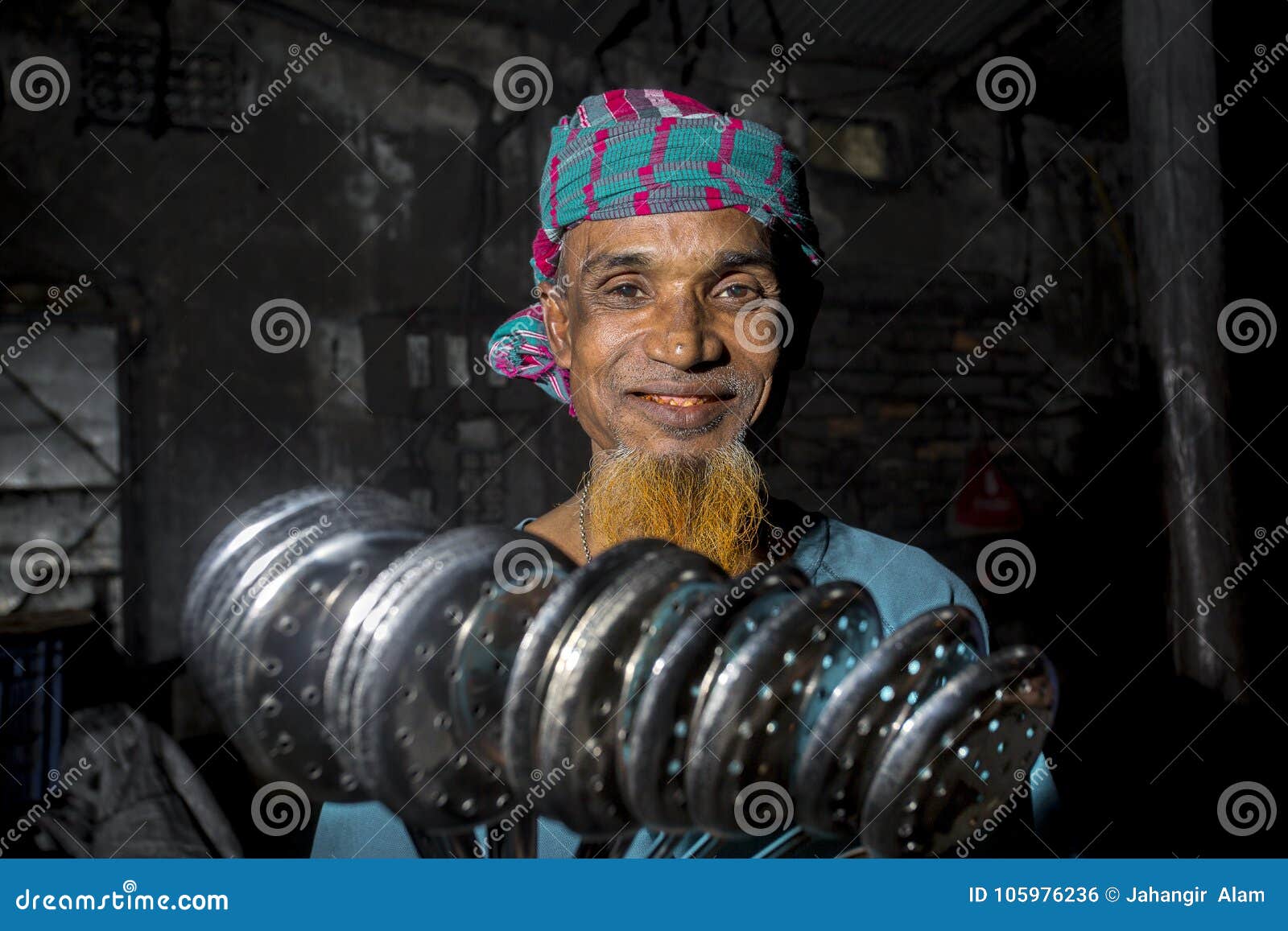 Steel spoon maker worker Bangladesh. Spoon-Making Factory Workers at a steel recycling and steel spoon making factory in Dhaka. Many child labors are working a spoon factory at Hajaribag near of Burigonga River. The factory Environment is too unhealthy and exotic. There are no safety measures in place; the work can be extremely dangerous. Child labor, although illegal in most of the countries.