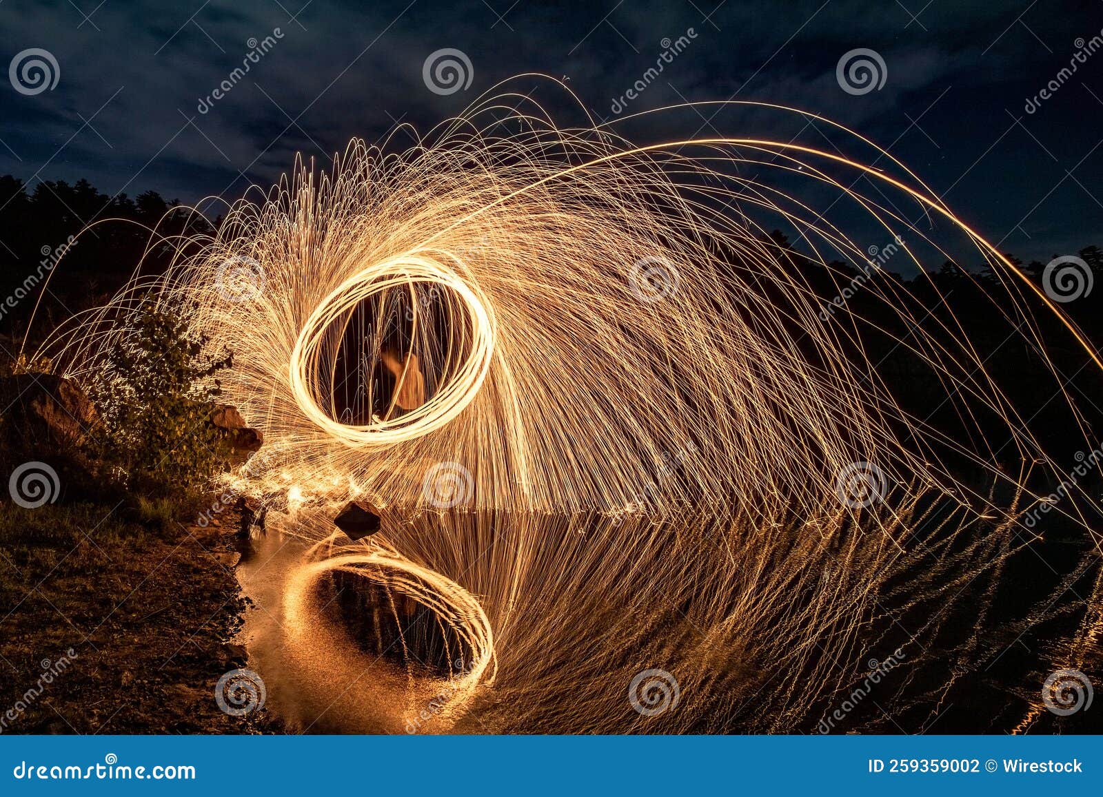 Steel Wool Painting and Reflection on the Lake. Stock Photo Image of