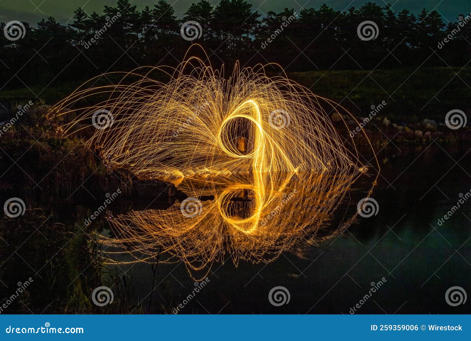 Steel Wool Painting and Reflection on the Lake. Stock Photo Image of