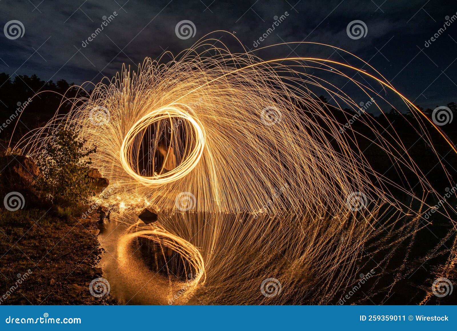 Steel Wool Painting and Reflection on the Lake. Stock Image Image of