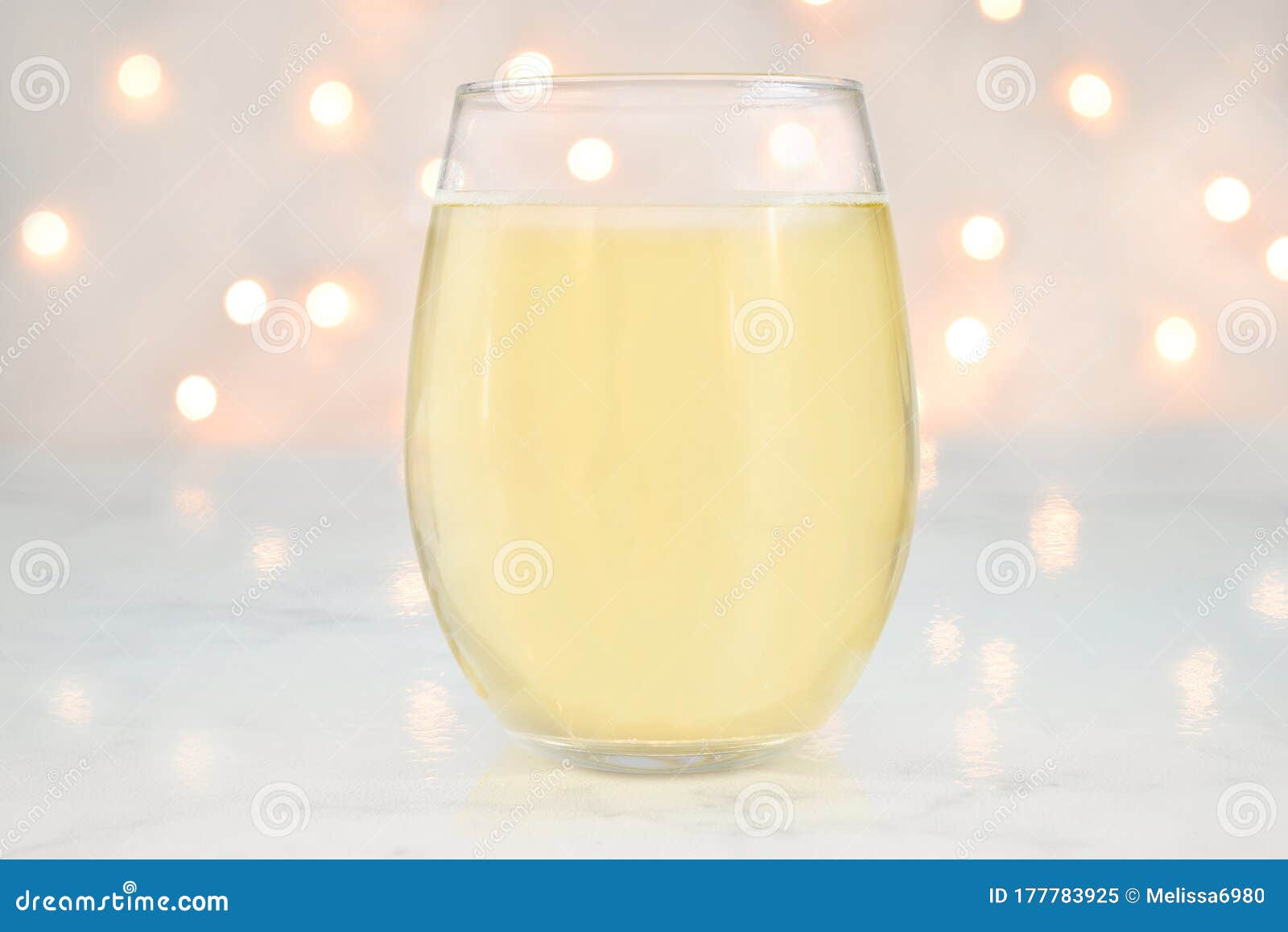 https://thumbs.dreamstime.com/z/stemless-wine-glass-mockup-glowing-bokeh-lights-no-stem-wineglass-featuring-filled-white-glow-romantically-177783925.jpg