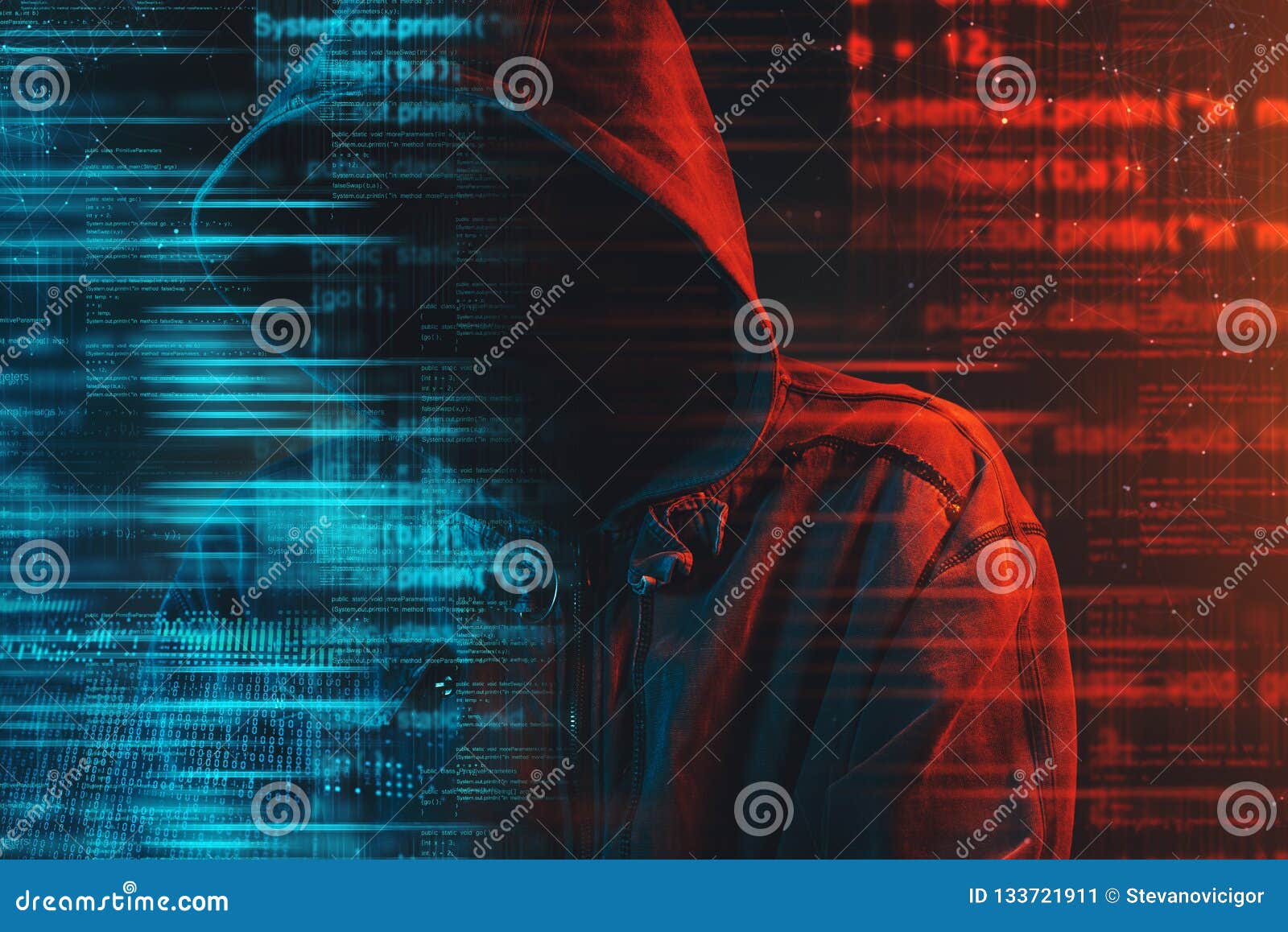 stereotypical image of computer hacker with hoodie and computer